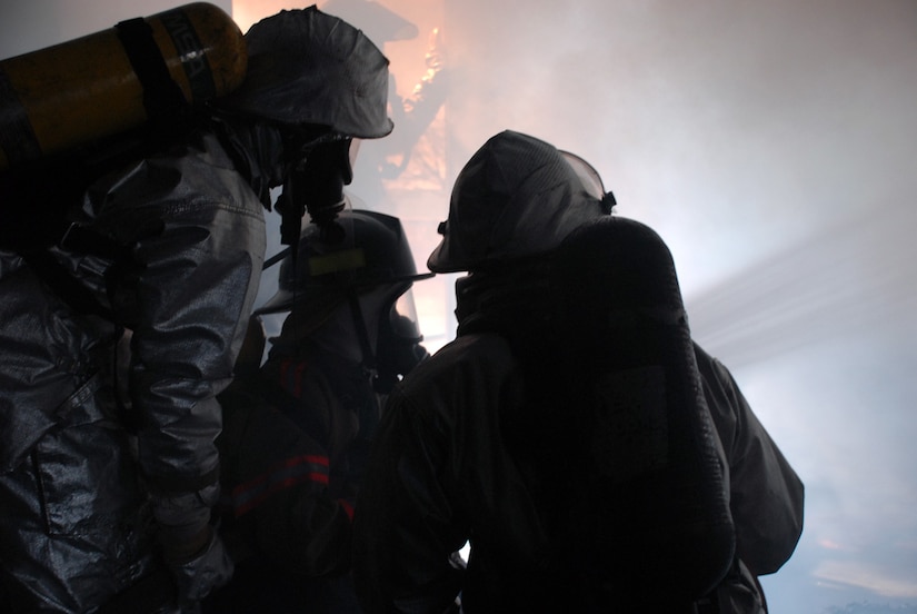 Honduran firefighters extinguish a blaze in the Joint Task Force-Bravo "burn house"; a two-level training structure used to provide firefighters with a realistic firefighting experience. The firefighters are participating in a JTF-Bravo-sponsored firefighting subject matter expert exchange and hundreds of firefighters from fire departments across Honduras have participated over the last two years. (U.S. Air Force photo by Tech. Sgt William Farrow)