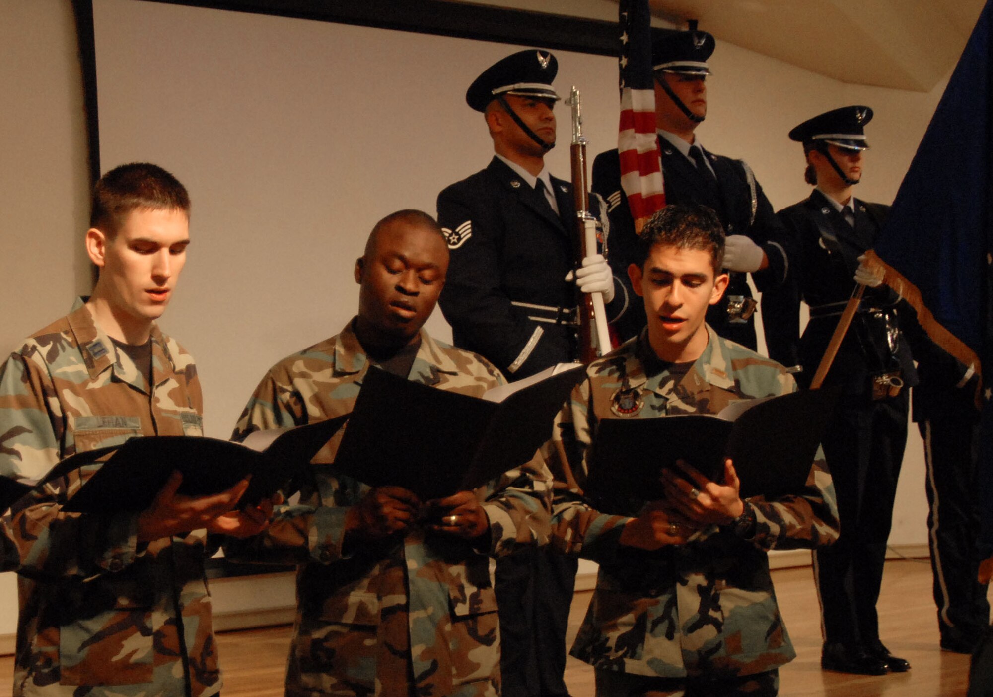 The Edwards Chapel combined choir sings "God Bless America" at the National Prayer Breakfast on Feb. 21 at Club Muroc here. Chaplain (Col.) Wayne Knutson, Air Force Intelligence, Surveillance and Reconnaissance Agency senior agency staff chaplain, was the guest speaker for the event. (Air Force photo by Airman 1st Class Stacy Sanchez)