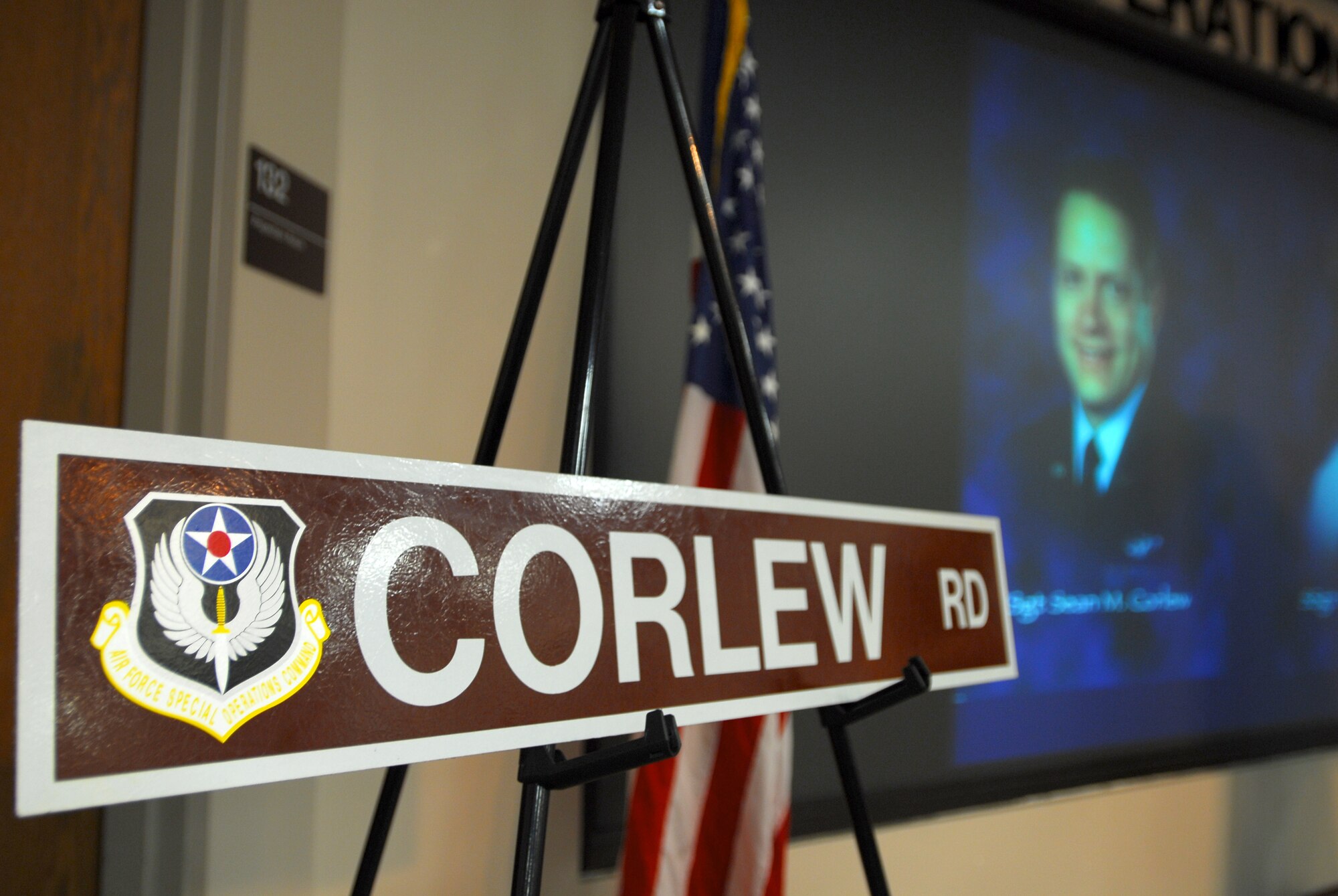 The 15th Special Operations Squadron honored Tech. Sgt. Sean Corlew in a ceremony Feb. 22 by renaming a base road after him. Sergeant Corlew was killed in an aircraft crash in Afghanistan in 2002. (U.S. Air Force photo/Airman 1st Class Jason Epley)