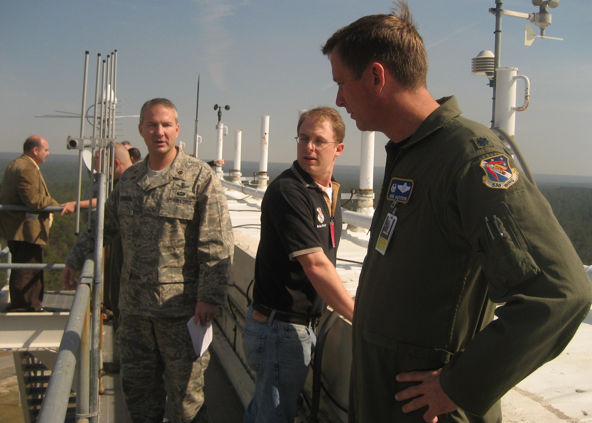 EGLIN AIR FORCE BASE, Fla. – (L-R) Major Paul Tombarge, 20th Space Control Squadron director of operations, explains to Brian Burger, 36th Electronic Warfare Squadron honorary commander, and Lt. Col. Gene Anderson, 68th Electronic Warfare Squadron commander, about some of the daily operations that take place at the site, while they take in the view from 143 feet above the ground. The face of the radar is actually covered with a giant tarp that weighs a few tons and is held into place by four pumps creating a vacuum seal. Total volume of the building is around 2.5 million cubic feet. (U.S. Air Force photo 1st Lt. Autumn Lorenz)