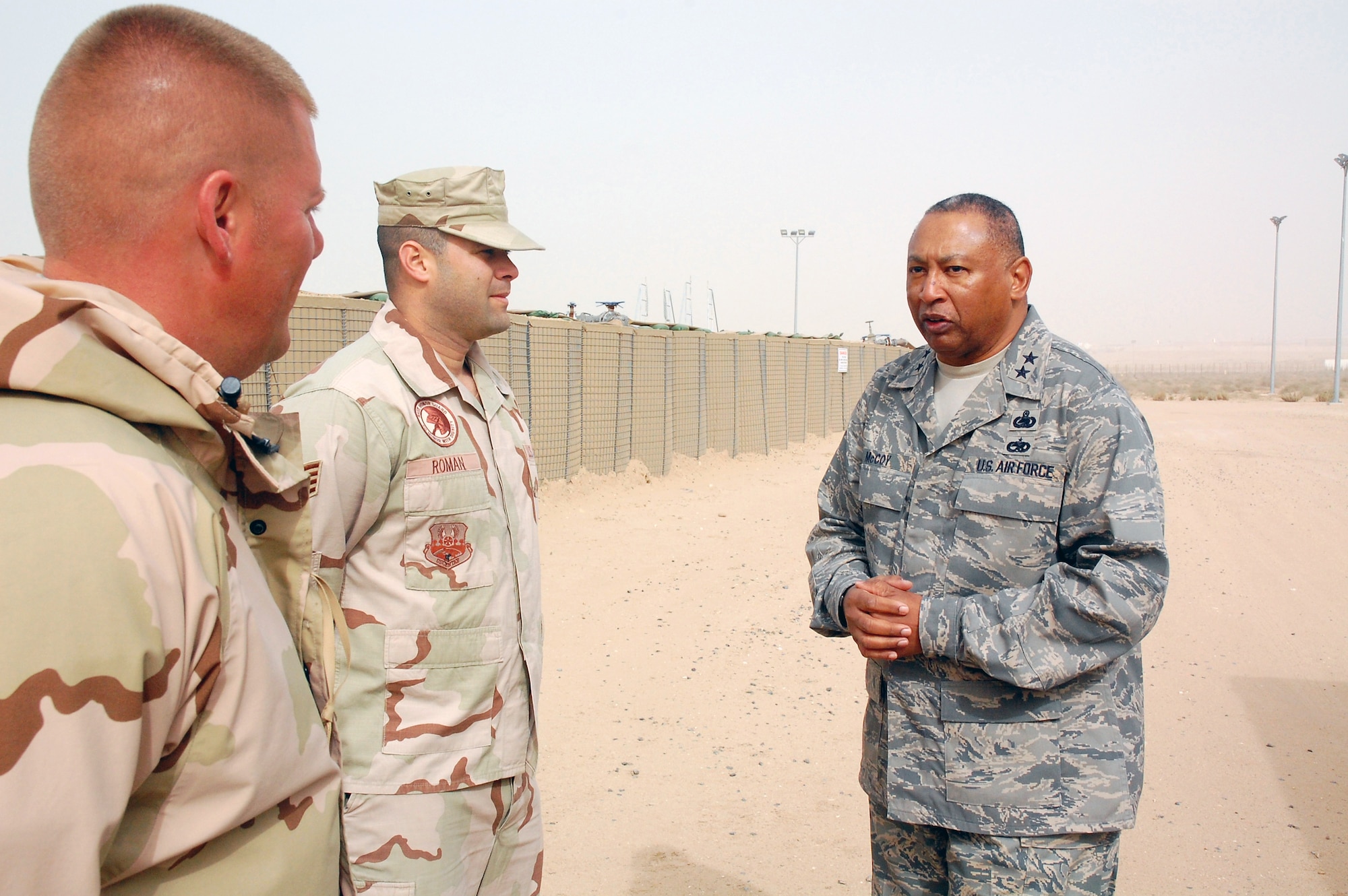 Maj. Gen. Gary T. McCoy, director of logistics readiness for the office of the deputy chief of staff for logistics, talks with Tech. Sgt. Dennis Wallace (left) and Staff Sgt. Jimmy Roman Feb. 16 at an air base in Southwest Asia.  Sergeant Wallace is deployed from McGuire Air Force Base, N.J., and Sergeant Roman is deployed from Pope AFB, S.C.  They work at the 386th Air Expeditionary Logistics Readiness Squadron fuels facility. The general's visit was the last stop on a tour of five bases in the Central Command area of operations. (U.S. Air Force photo/Capt. Jason McCree)
