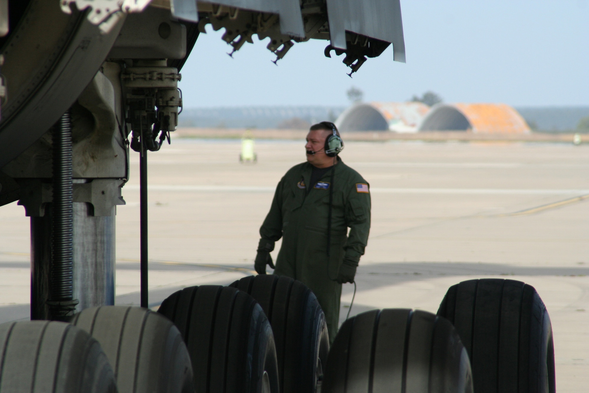 SMSgt Allan Blackwell, a flight engineer with the 445th Operations Support Squadron, uses his headset to communicate with the rest of the flight crew as they prepare the C-5 for take-off at Moron Air Base, Spain.  Moron was one of the stops the C-5 made on this mission from Wright-Patterson AFB, Ohio, to Kuwait, then back to home station.

The 445th Airlift Wing began flying regular missions to Kuwait in January, 2008, in support of U.S. forces in Iraq and Afghanistan.  The flights leave Wright Patterson AFB, Ohio, load cargo at an East Coast base, then fly into Ramstein AB, Germany.  The plane then heads to Kuwait and makes its way back to Wright-Patt. (U.S. Air force photo/Maj. Ted Theopolos)
