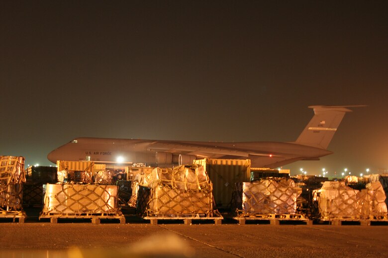 A 445th Airlift Wing C-5 sits on the flightline at Kuwait International Airport.
The 445th Airlift Wing began flying regular missions to Kuwait in January, 2008, in support of U.S. forces in Iraq and Afghanistan.  The flights leave Wright Patterson AFB, Ohio, load cargo at an East Coast base, then fly into Ramstein AB, Germany.  The plane then heads to Kuwait and makes its way back to Wright-Patt. (U.S. Air Force photo/Maj. Ted Theopolos)
