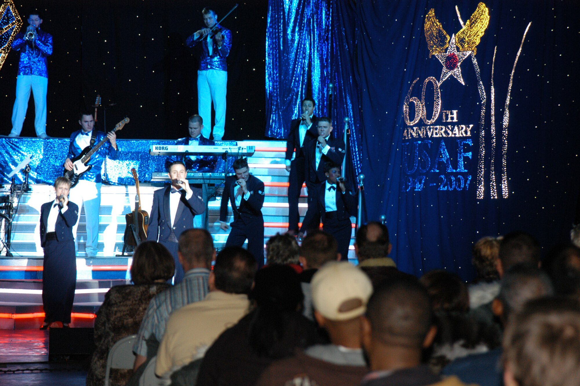 THULE AIR BASE, Greenland -- Tops in Blue entertainers perform the final song of their show Wednesday evening for a crowd of approximately 300 Airmen and civilians here. The group arrived at the Top of the World Tuesday night and had to adjust to the time change and more than a 100 degree temperature difference than their previous stop at Cannon Air Force Base, N.M. (U.S. Air Force photo/1st Lt. Nicole Langley)