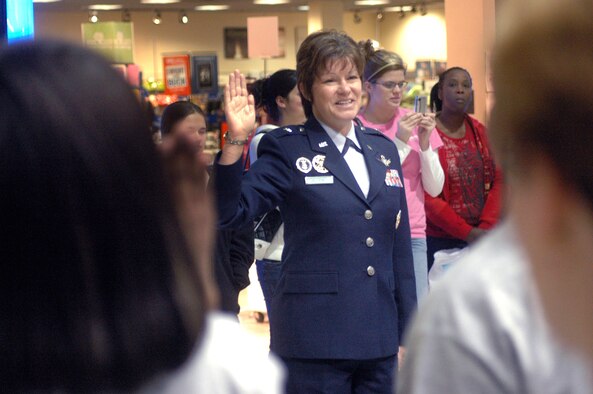 Brig Gen. Suzanne Vautrinot swears in 25 new Air Force recruits at Galleria Mall Feb. 19.  U. S. Air Force photo by Sue Sapp   
