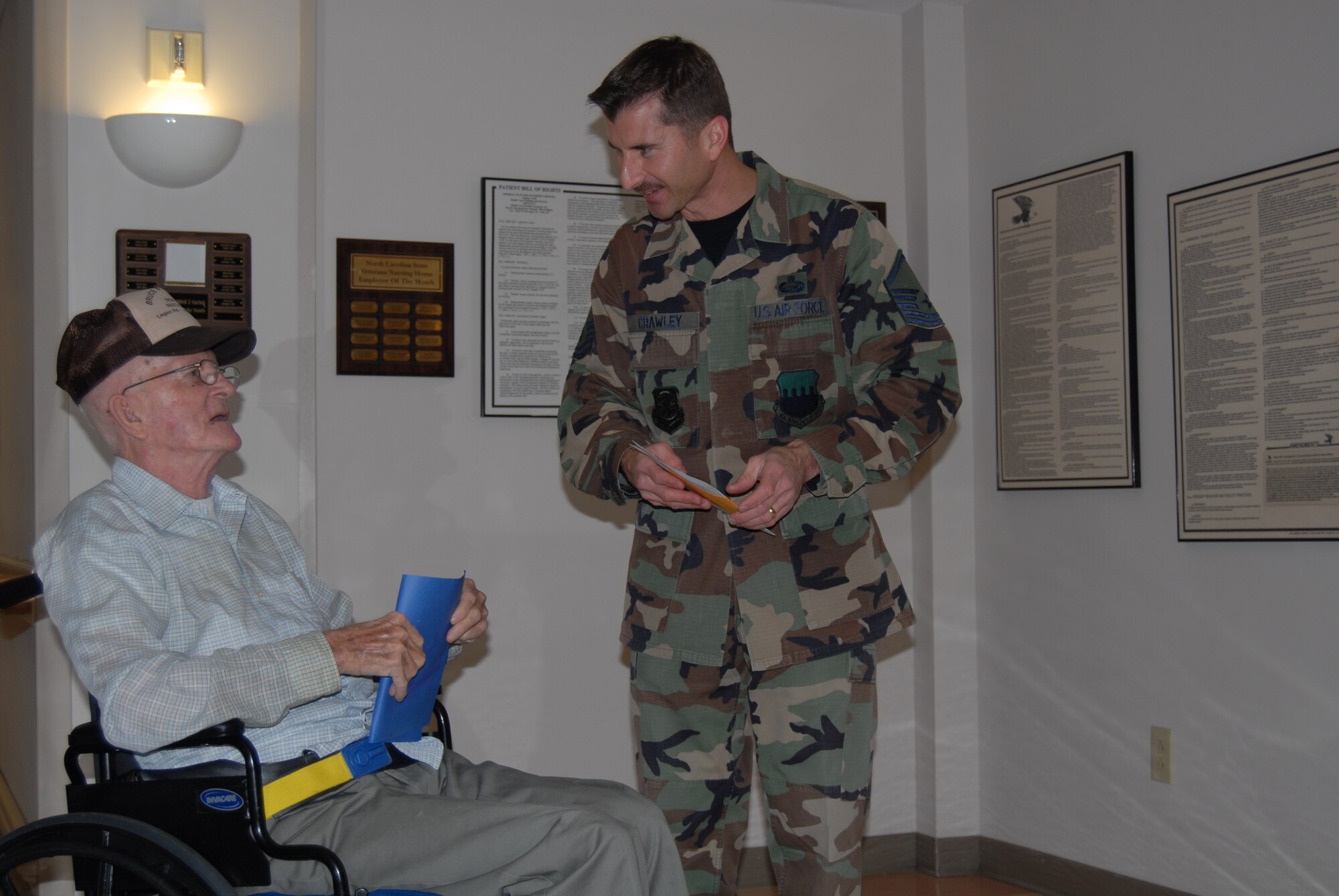 (Left) Master Sgt. Michael Crawley, 43rd Airlift Wing, talks to one of the residents of the Veteran’s Nursing Home in Fayetteville, N.C. Feb. 14. Members from Pope delivered cards and snacks to the residents on Valentine's Day as a way to show appreciation to the veterans. (U.S. Air Force Photo by Airman 1st Class Mindy Bloem)