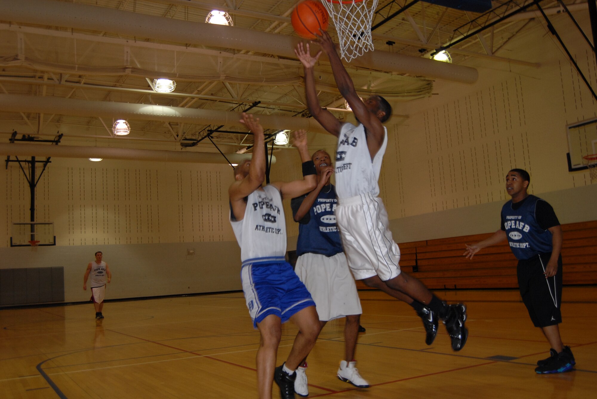 Irvin Gourdine, 43rd Mission Support Squadron, grabs a rebound during the Feb. 13 game against 43rd Maintenance Squadron. 43rd MXS started the game on an 18-5 run, but lost 49-44. (U.S. Air Force Fhoto by 2nd Lt. Chris Hoyler)