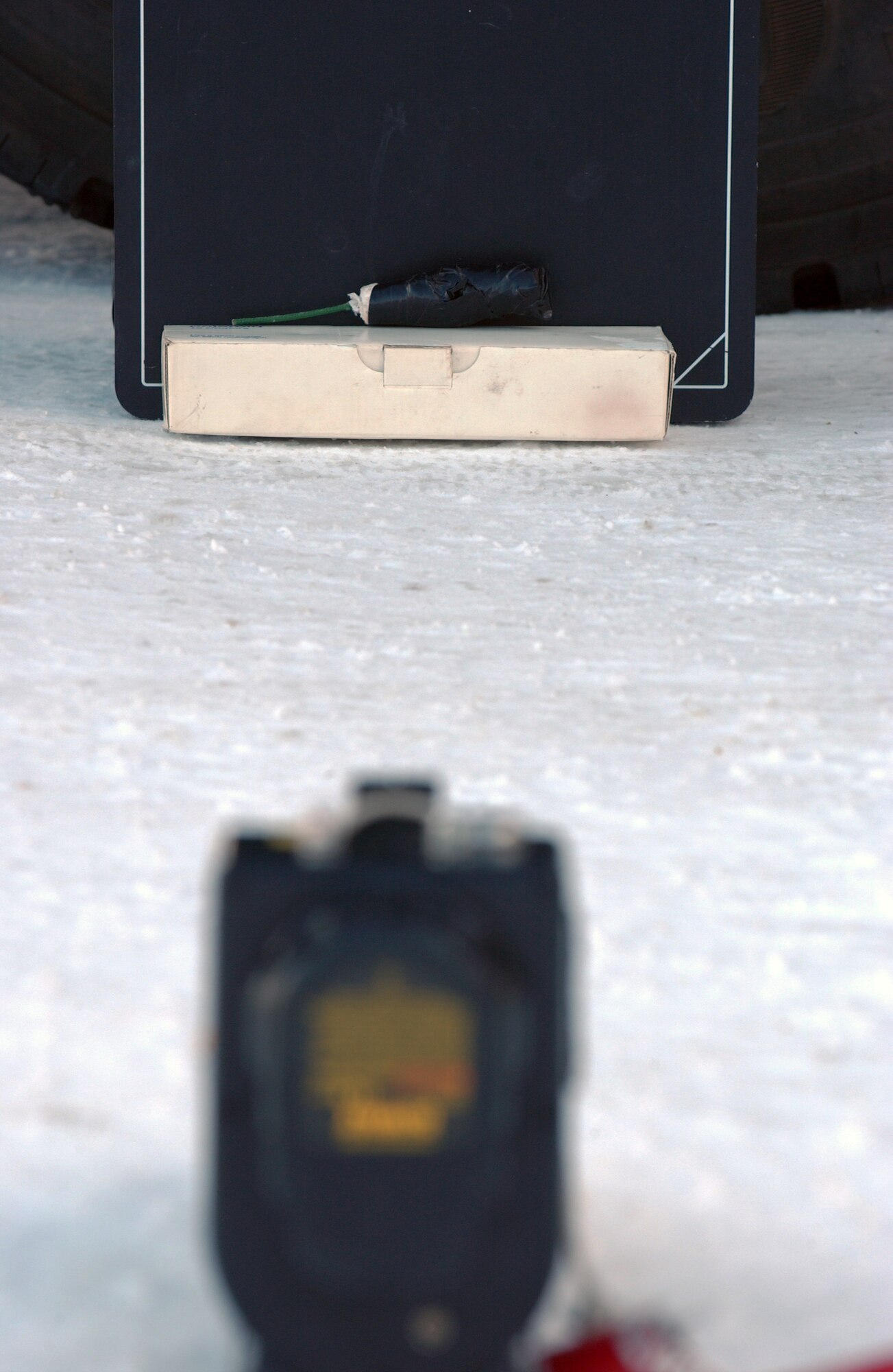 EIELSON AIR FORCE BASE, Alaska -- Staff Sgt. Christopher Adams and Senior Airman Steven Harris X-ray a suspected improvised explosive device, checking the explosive power it contains Feb. 21, in Fairbanks. The 354th Civil Engineer Squadron Explosive Ordnance Disposal flight responded to a call from a state trooper that confiscated a suspected IED and ammunition from a local civilian in Fairbanks. Eielson EOD is the only unit in central Alaska with explosive ordnance disposal capabilities. (U.S. Air Force Photo/Airman 1st Class Jonathan Snyder)