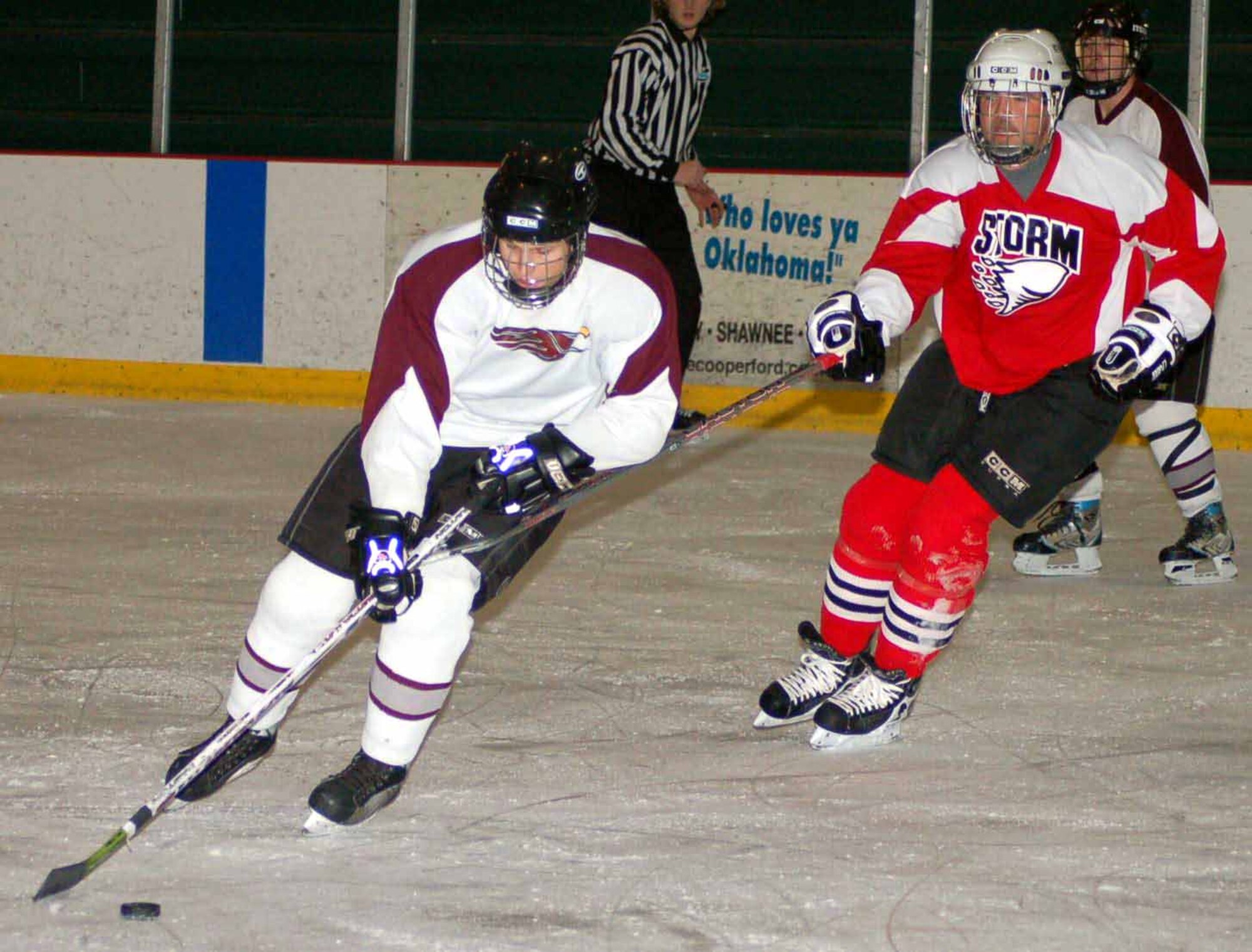 Hawks forward Todd Bayles skates past Storm defensemen Dan Stoner in the second period during at game at the Blazers Ice Center on Feb 17. The Hawks won the game 4-0.  (Air Force photo by John E. Banks)