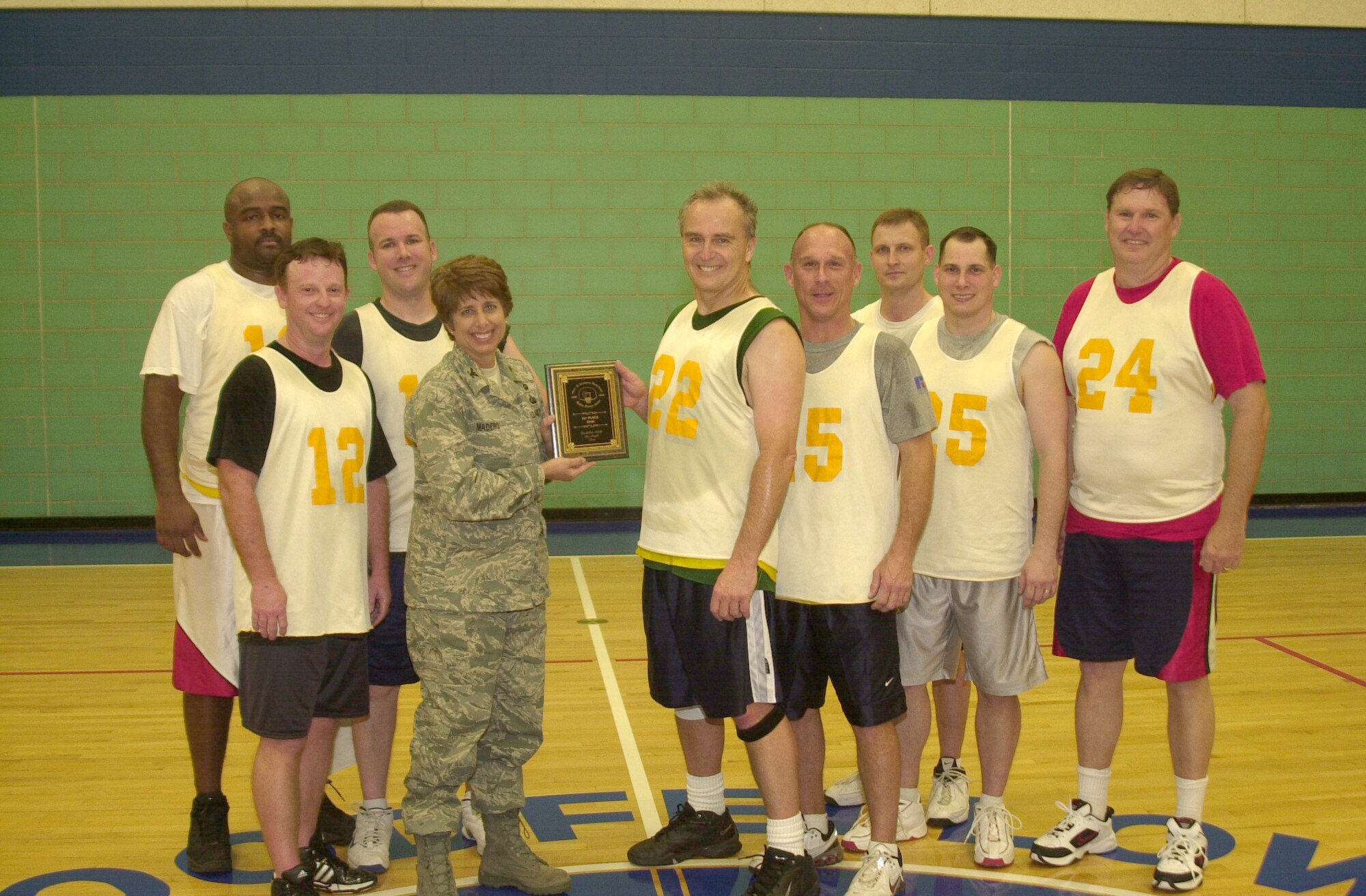 Col. Merrily Madero, 17th Training Wing vice commander, was on hand to present the 17th Training Wing team with a plaque commemorating their win of the 2008 Over-30 Basketball League Championship Feb. 13 at the Mathis Fitness Center gymnasium. (U.S. Air Force photo by Senior Airman Luis Loza Gutierrez)