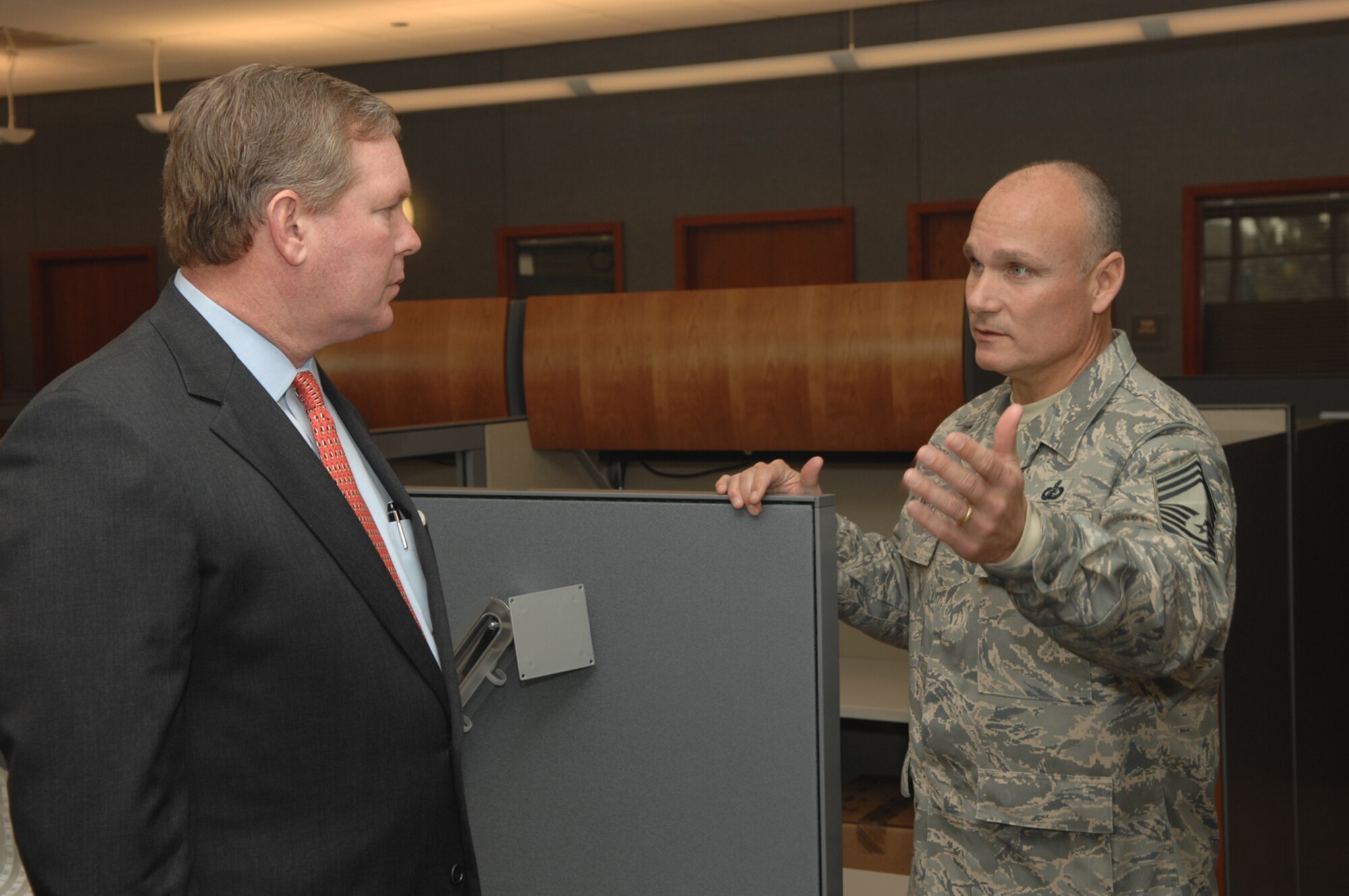 Chief Master Sgt. Kenneth Kirtley, the Chief Enlisted Manager of the Air Force Financial Services Center talks with Mr. John H. Gibson II, Assistant Secretary of the Air Force for Financial Management and Comptroller, at the AFFSC Feb. 19.  Mr. Gibson is visiting the new AFFSC on base. (U.S. Air Force photo by Airman 1st Class Joshua Seybert)
