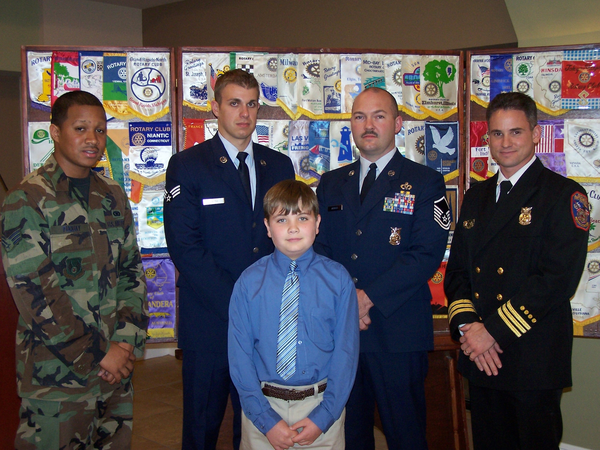 Niceville, Fla. -- Senior Airman Christopher Fuquay, Eglin AFB Security Police Airman of the Year; Senior Airman Brandon Smith, Eglin AFB Military Firefighter of the Year; Hunter Johnson representing his father Brian Johnson, Eglin AFB Civilian Firefighter of the Year; Master Sgt. Charles Arnold, Eglin AFB Military Fire Officer of the Year and Christopher Young, Eglin AFB Civilian Fire Officer of the Year.  Not Pictured: Charley Allen, Eglin AFB Security Police Officer of the Year. 
