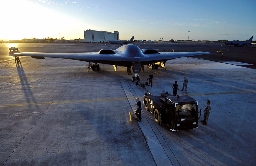 A B-2 Spirit is towed to a parking spot Feb. 12 at Hickam Air Force Base, Hawaii.  The B-2, from the 509th Bomb Wing at Whiteman Air Force Base, Mo., is one of four bombers currently deployed to Andersen Air Force Base, Guam, as part of U.S. Pacific Command's continuous bomber presence. (U.S. Air Force photo/Tech. Sgt. Shane A. Cuomo)