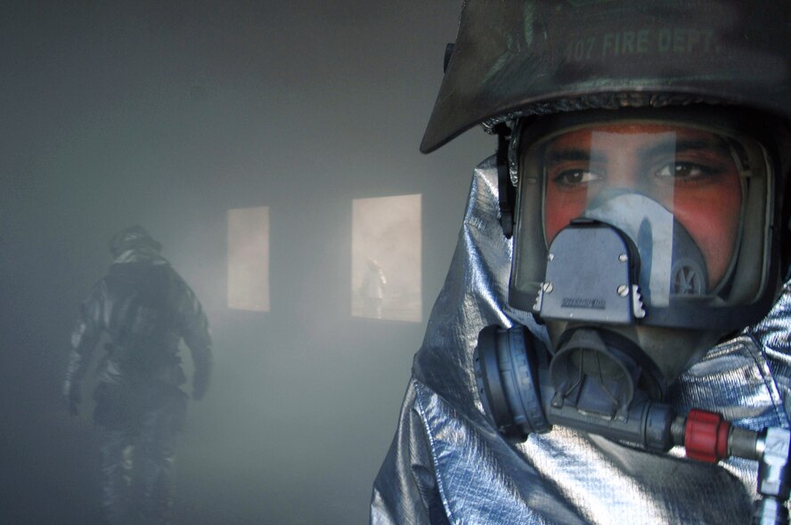 Staff Sgt. Arthur Curcione conducts joint training Feb. 12 with Iraqi firefighters from the fire department at Baghdad International Airport.  Sergeant Curcione is a firefighter with the New York Air National Guard's 107th Air Refueling Wing at Niagara Falls.  (U.S. Air Force photo/Tech. Sgt. Jeffrey Allen) 