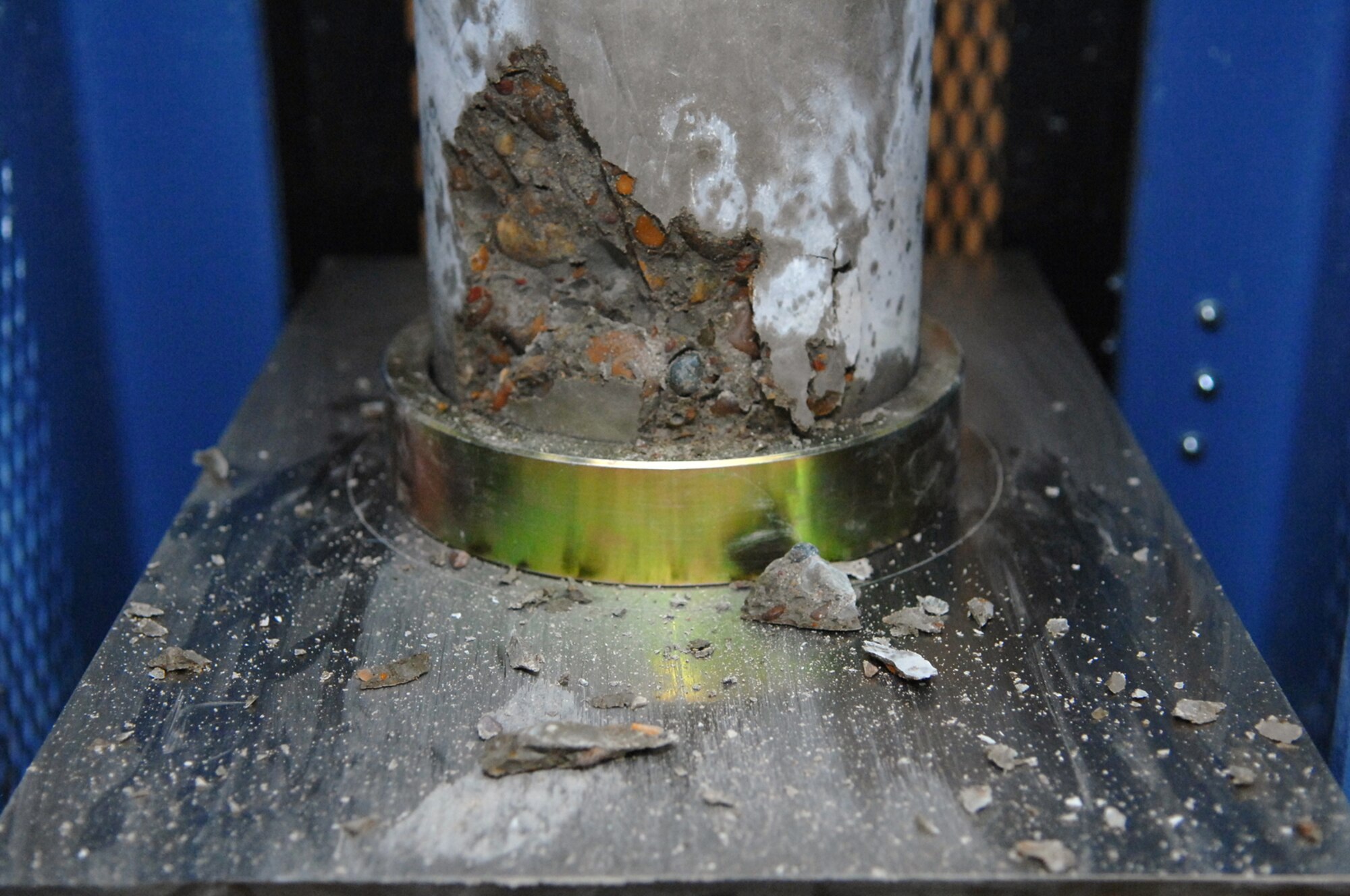 BALAD AIR BASE, Iraq -- A concrete cylinder sample taken from the new Housing 6 area shoppette foundation broke during the strength test at 5,100 pounds per square inch, which is a passing number here, Feb. 21. The minimum number to pass is 4,500 pounds per square inch. (U.S. Air Force photo/ Senior Airman Julianne Showalter) 
