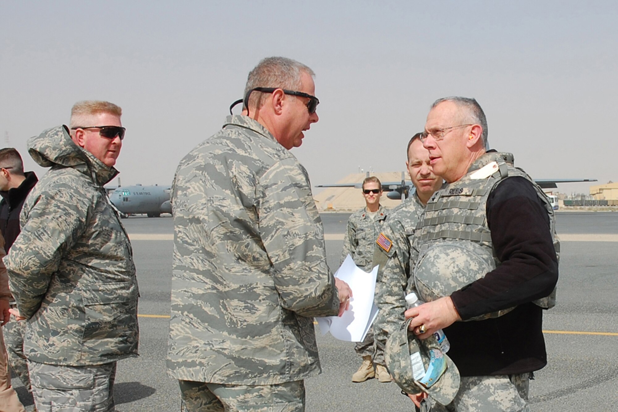SOUTHWEST ASIA -- Lieutenant Col. Thomas Saxe (center), 386th Expeditionary Operations Group deputy commander, and Lt. Col. John Bollard (left), 386th Expeditionary Mission Support Group Detachment-1 commander, greets U.S. Army Maj. Gen. Raymond Rees, after arriving at a Southwest Asia air base Feb. 21, 2008. General Rees is the adjutant general for the Oregon National Guard and is responsible for providing the State of Oregon and the United States with a ready force of citizen Soldiers and Airmen, equipped and trained to respond to any contingency, natural or manmade. The stop capped off a five day tour through the deployed area of responsibility where Guardsmen from Oregon are assigned. (U.S. Air Force photo/ Staff Sgt. Patrick Dixon)