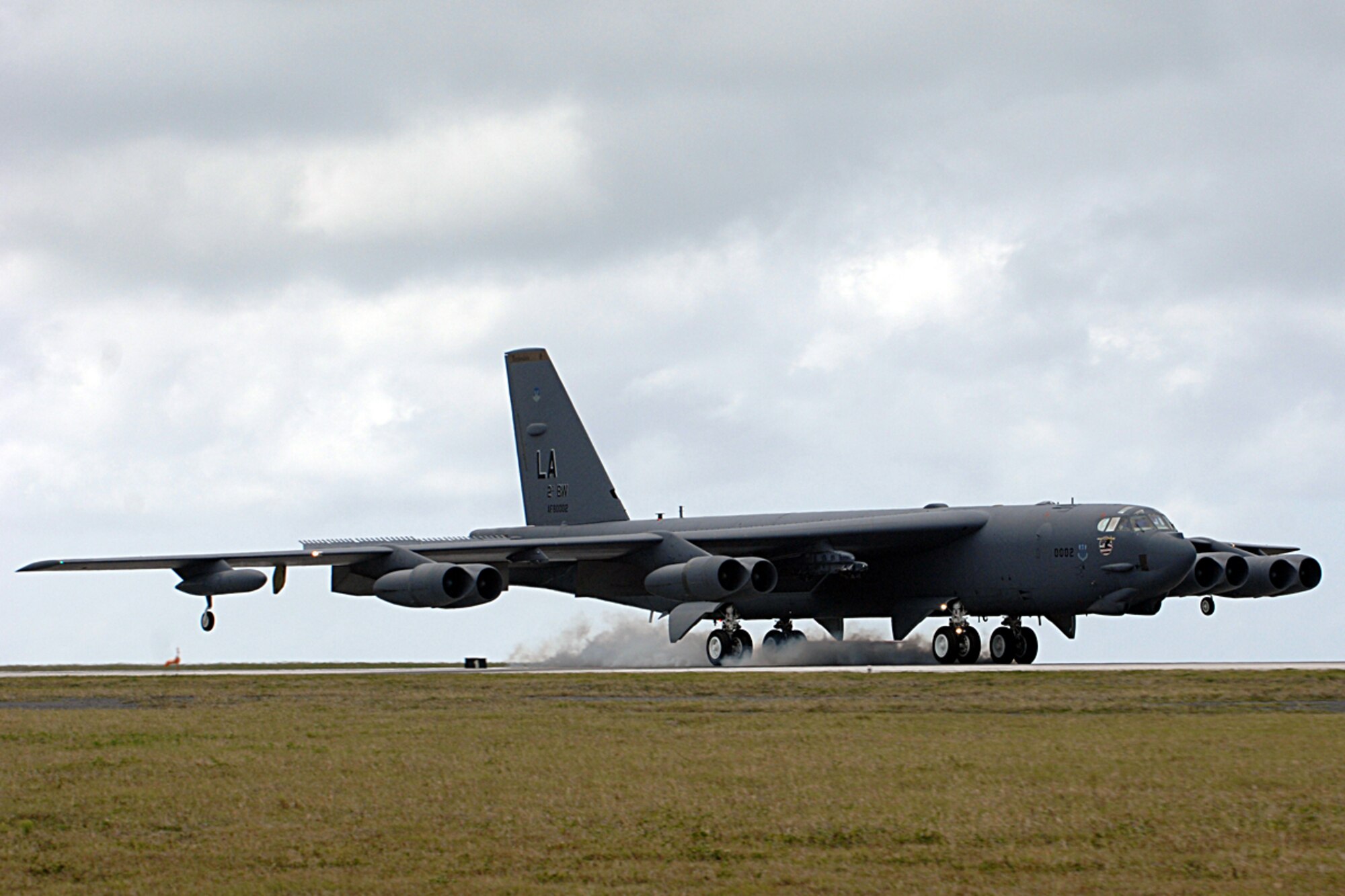 Andersen AFB, Guam -- A B-52 Stratofortress bomber  from the 96th Expeditionary Bomb Squadron lands on Andersen AFB. The rotating bomber units promote security and stability in the region as well as provide unique aircrew training opportunities. The 96th EBS is deployed here from Barksdale AFB, La.
(U.S. Air Force Photo By Staff Sgt. Vanessa Valentine) 