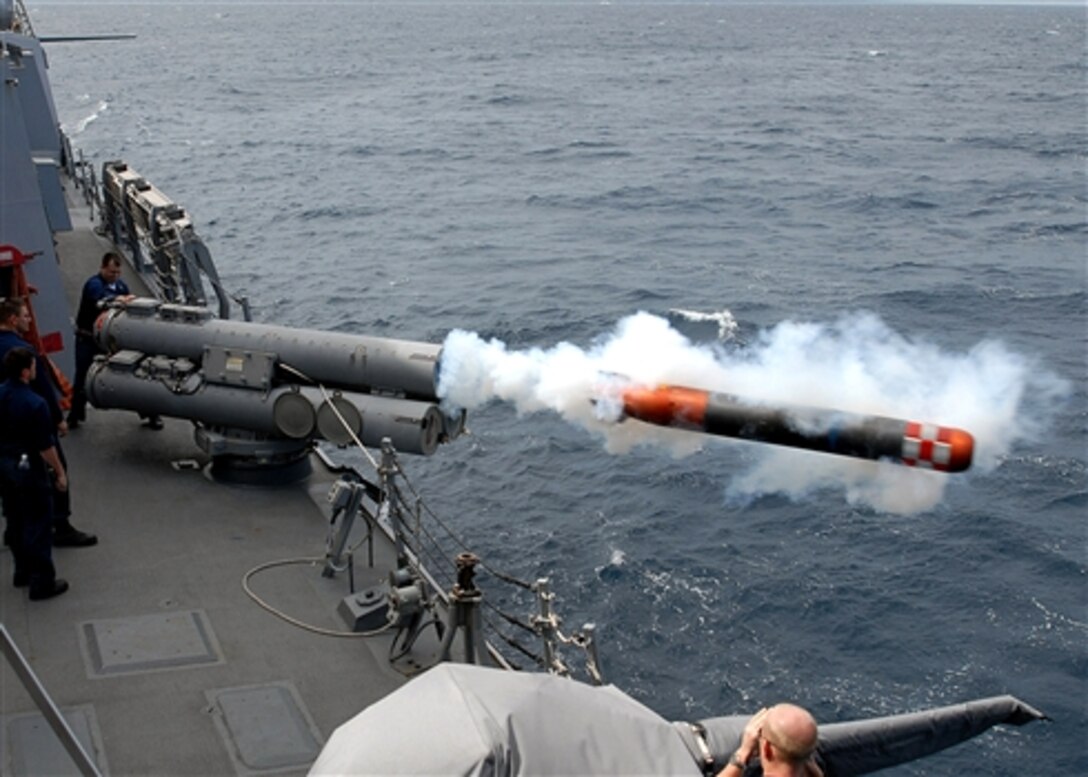 Weapons department personnel launch an inactive torpedo off the port side of the Arleigh Burke-class guided-missile destroyer USS Mustin, Feb. 21, 2008. The launch was part of a training exercise. Mustin is attached to Destroyer Squadron 15 and deployed to Yokosuka, Japan. 