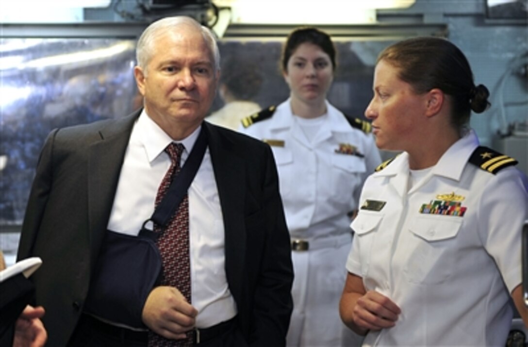 U.S. Navy Lt. Courtney Minetree gives Secretary of Defense Robert M. Gates a tour of the of the engineering spaces on board the destroyer USS Russell (DDG 59) moored in Pearl Harbor, Hawaii, on Feb. 21, 2008.  Gates toured the Arleigh Burke Class destroyer and visited with the crew.  Minetree is the chief engineer on the ship.  