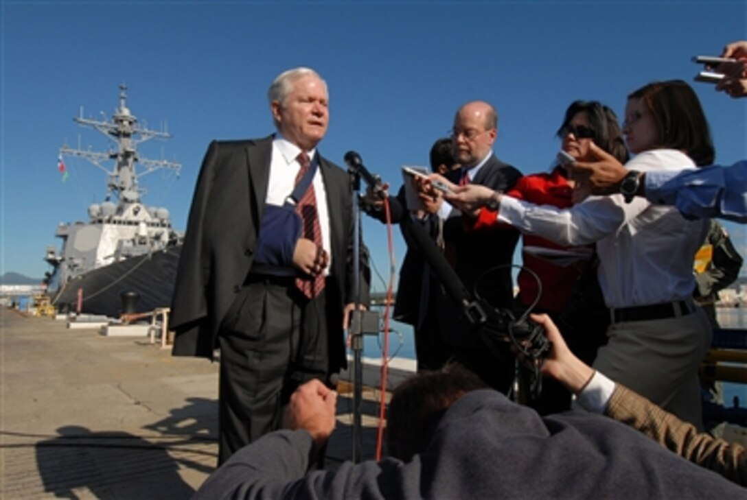 Secretary of Defense Robert M. Gates speaks with the media during a press conference on the pier at Naval Station Pearl Harbor, Hawaii, on Feb. 21, 2008.  Gates earlier toured the Arleigh Burke Class destroyer USS Russell (DDG 59).  Gates expressed his gratitude to the people of Hawaii for their support of our military and military families.  