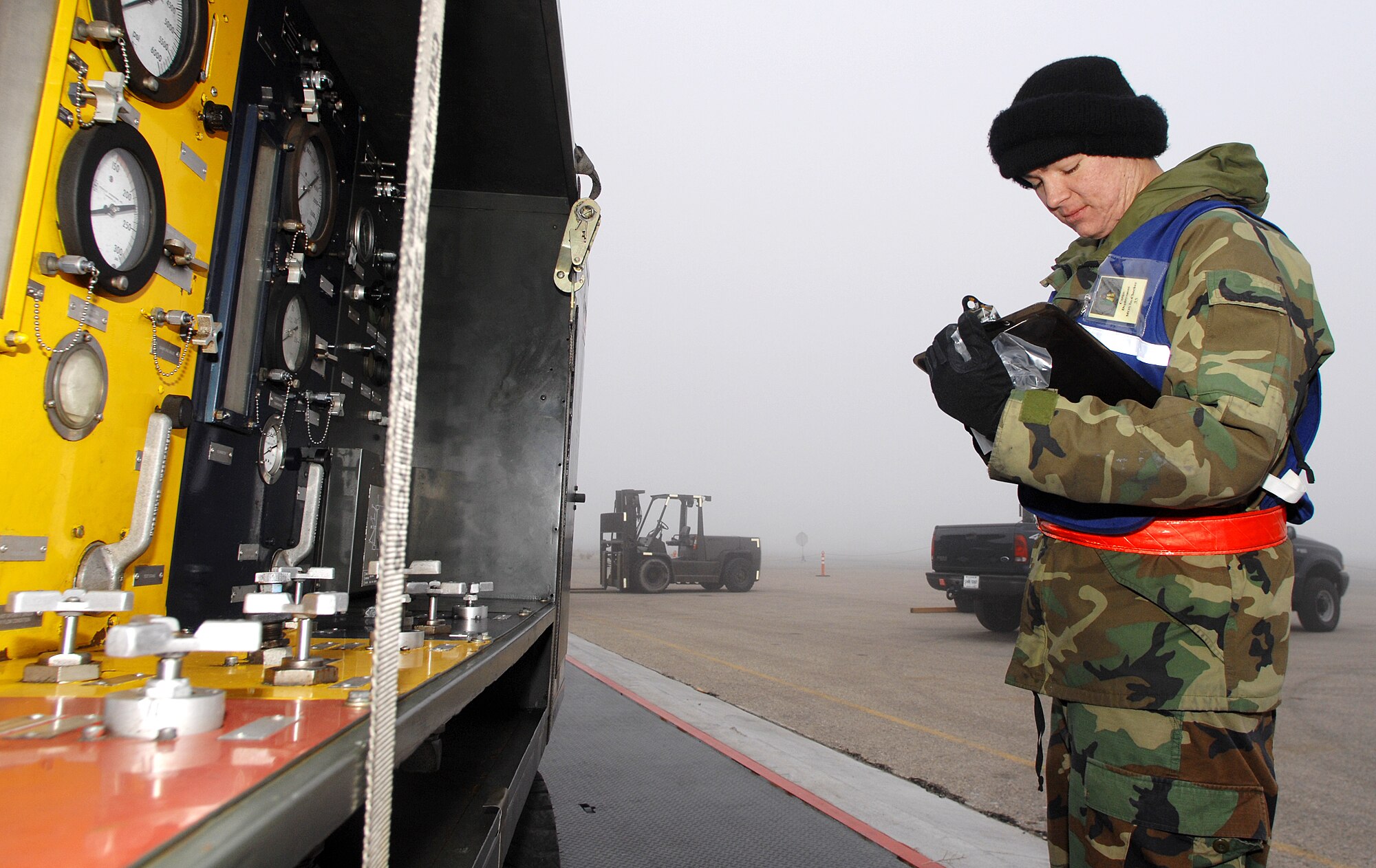 MOUNTAIN HOME AIR FORCE BASE, Idaho – Airman 1st Class Andrew Kovacovich, 366th Aircraft Maintenance Squadron cargo deployment function in-check technician, writes down the weight of equipment being processed for deployment during Exercise Sharpshooter 08-04 Feb. 23. The CDF is responsible for measuring, weighing and taking accountability for all the cargo on base that will be processed for deployment.  The 366th Fighter Wing conducts exercises to prepare personnel and equipment for the upcoming March 2008 Operational Readiness Inspection. (U.S. Air Force photo/ Airman 1st Class Ryan Crane)