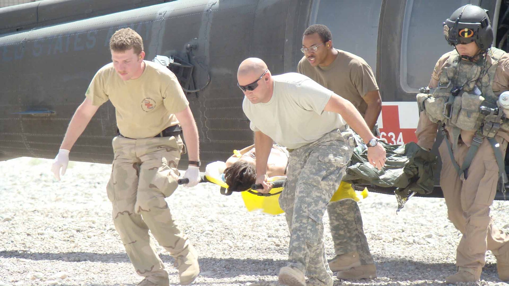 Staff Sgt. Chris Boykins helps unload a MEDEVAC patient in the Central Command's area of responsibility.  (Courtesy photo)