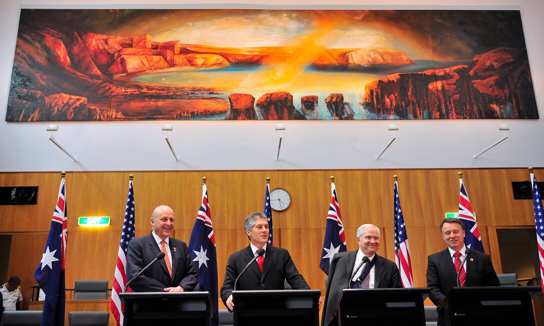 From left: U.S. Deputy Secretary of State John Negroponte, Australian Minister of Foreign Affairs Stephen Smith, U.S. Defense Secretary Robert M. Gates and Australian Minister of Defense Joel Fitzgibbon hold a press conference after signing an agreement for a Military Satellite Communication Partnership during the Australian Ministerial held in Canberra, Australia, Feb. 23, 2008.