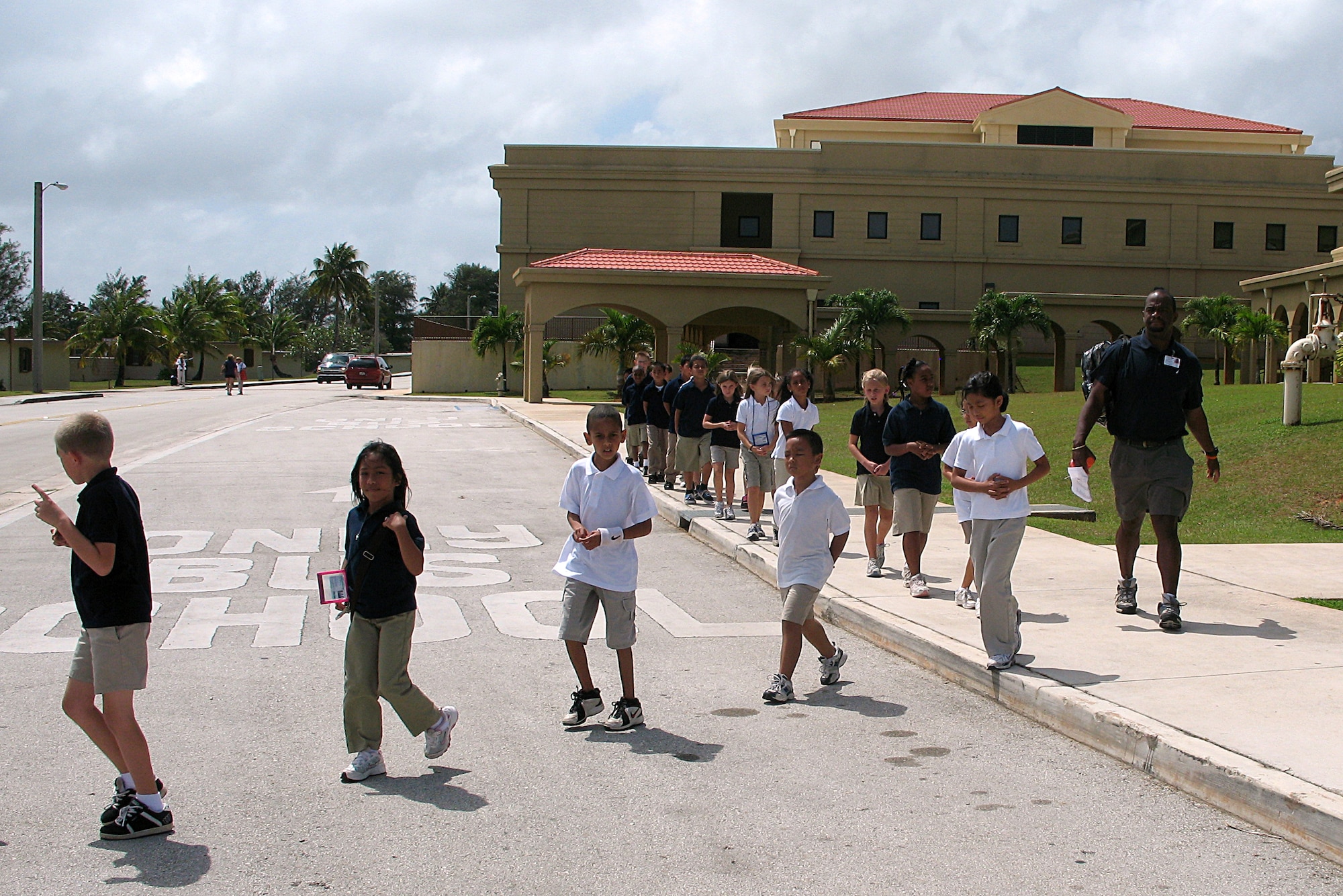 Andersen Elementary School teacher Jacob Dowdell guides his students to a evacuation location during a simulated bomb threat exercise held at Andersen schools Feb. 20. (U.S. Air Force photo by Airman 1st Class Carissa Wolff)