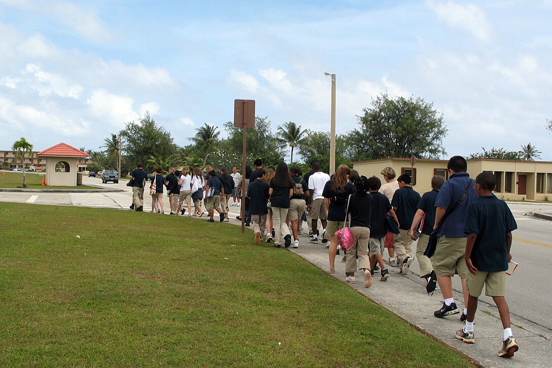 Students from Andersen Middle School make their way to the soccer field in front of the school during a simulated bomb threat evacuation exercise held on Anderse Feb. 20. The school was evacuated in under four minutes. (U.S. Air Force photo by Airman 1st Class Carissa Wolff)