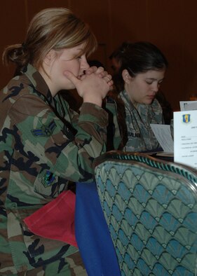 MISAWA AIR BASE, Japan -- Military members pray during the annual prayer breakfast at the enlisted club on Feb. 21, 2008. The prayer breakfast is intended to gather people from around the base and spend a few moments in prayer together. (U.S. Air Force photo by Senior Airman Robert Barnett)