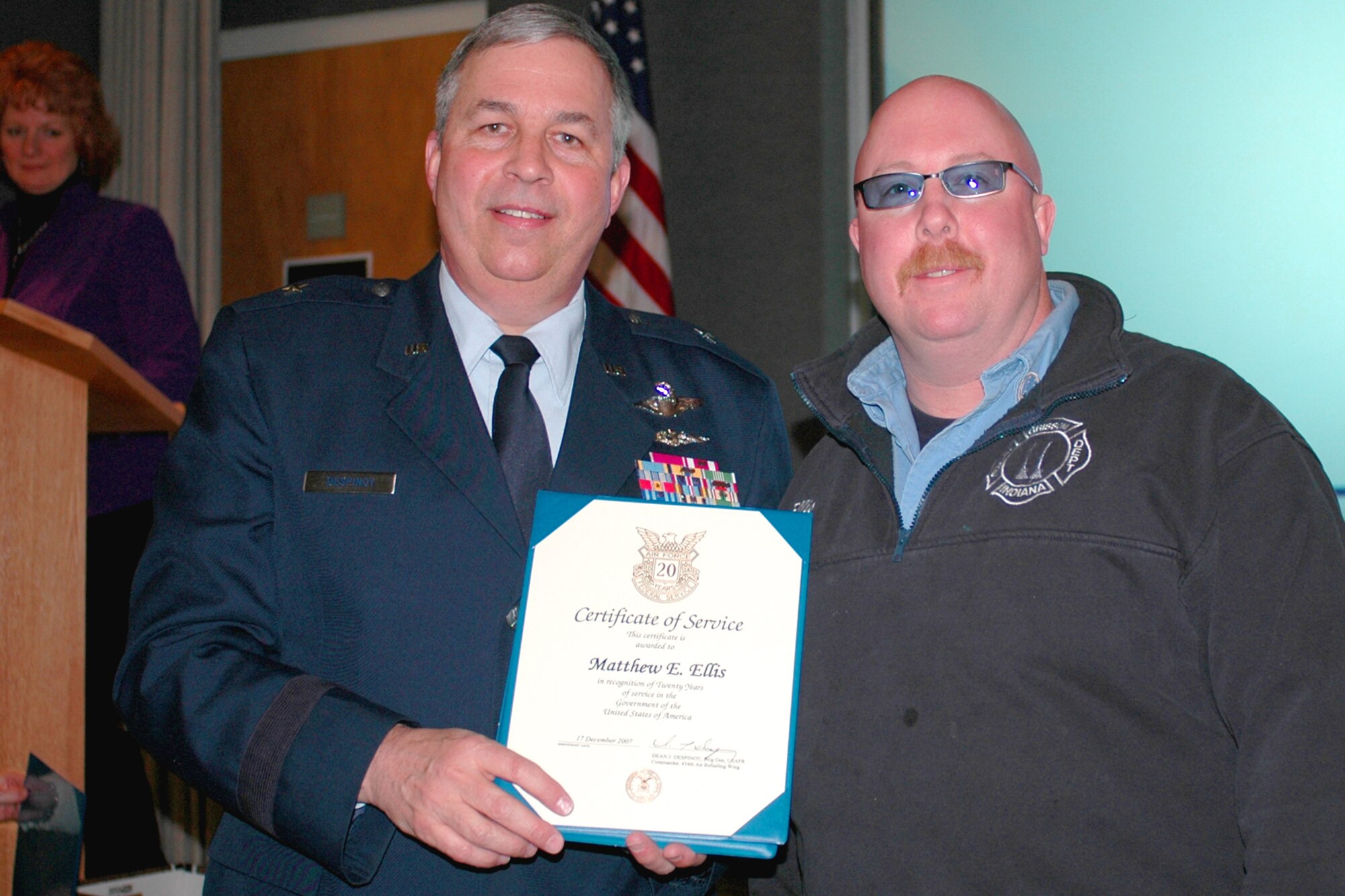 GRISSOM AIR RESERVE BASE, Ind., --  Brig. Gen. Dean Despinoy, 434th Air Refueling Wing commander, left, presents Matthew Ellis, Grissom Fire Department, a certificate marking his 20 years of federal service. The presentation was made during a special civilian commander's call held recently. (U.S. Air Force photo/Tech. Sgt. Doug Hays)