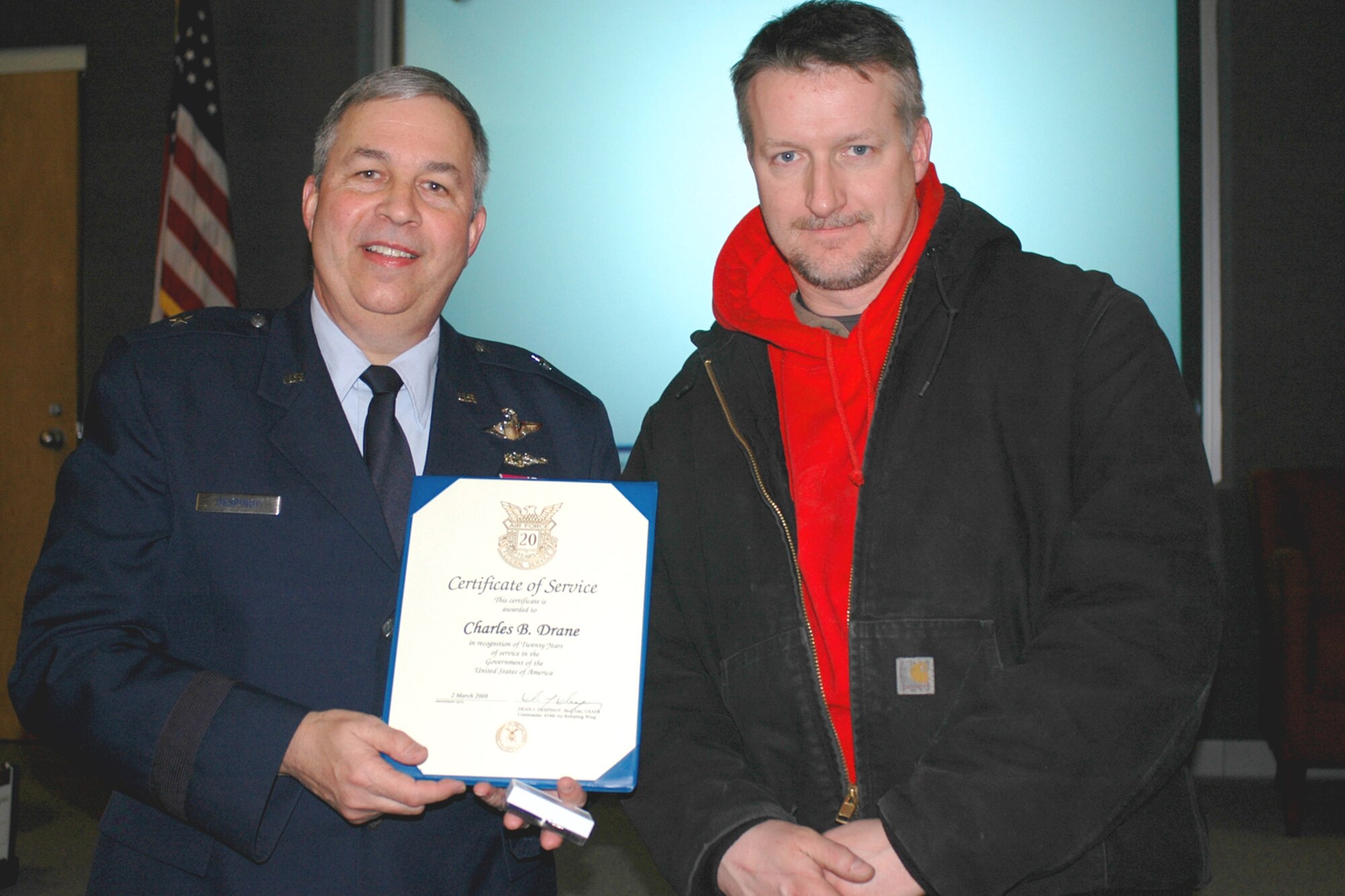GRISSOM AIR RESERVE BASE, Ind., --  Brig. Gen. Dean Despinoy, 434th Air Refueling Wing commander, left, presents Charles Drane, 434th Maintenance Squadron, a certificate marking his 20 years of federal service. The presentation was made during a special civilian commander's call held recently. (U.S. Air Force photo/Tech. Sgt. Doug Hays)