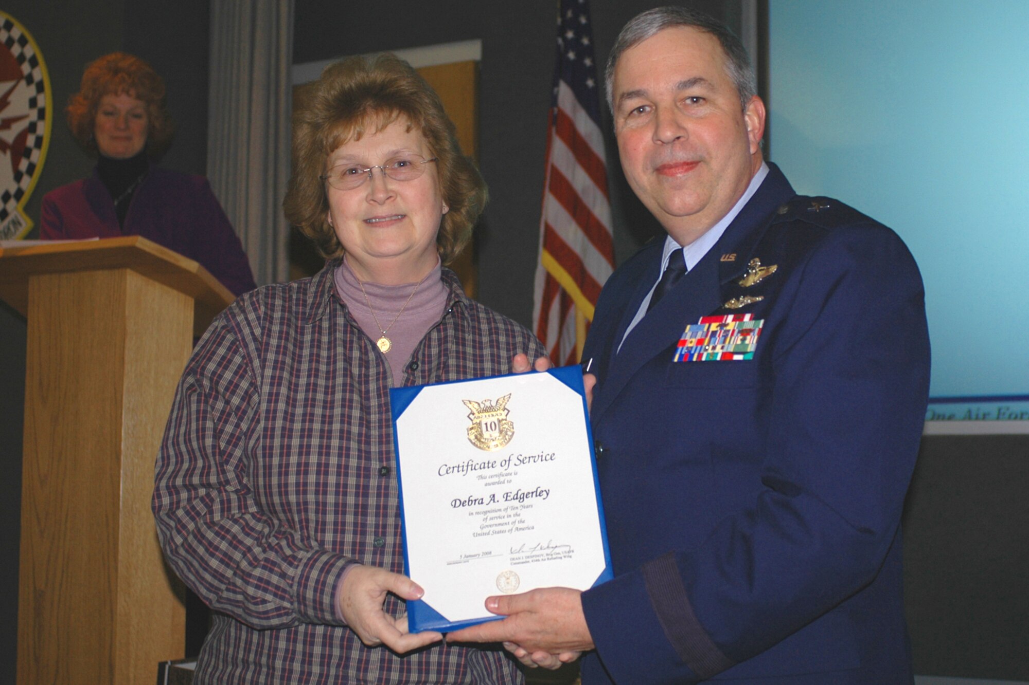 GRISSOM AIR RESERVE BASE, Ind., --  Brig. Gen. Dean Despinoy, 434th Air Refueling Wing commander, presents Debra Edgerley, 434th Civil Engineers Squadron, a certificate marking her 10  years of federal service. The presentation was made during a special civilian commander's call held recently.  (U.S. Air Force photo/Tech. Sgt. Doug Hays)