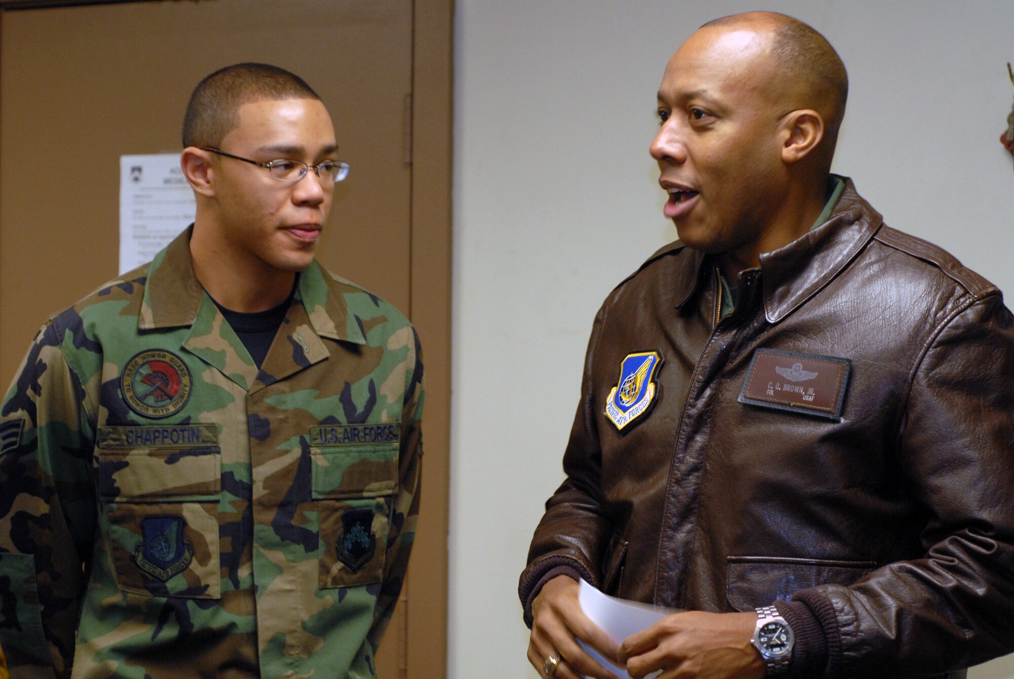 KUNSAN AIR BASE, South Korea -- Colonel CQ "Wolf" Brown 8th Fighter Wing commander, congratulates Senior Airman Argelio Chappotin 8th Civil Engineer Squadron, here Feb. 12. Airman Chappotin was selected as the 8th Fighter Wing's Pride of the Pack  for the week of Feb. 11. (U.S. Air Force photo/Staff Sgt. Alice Moore)  