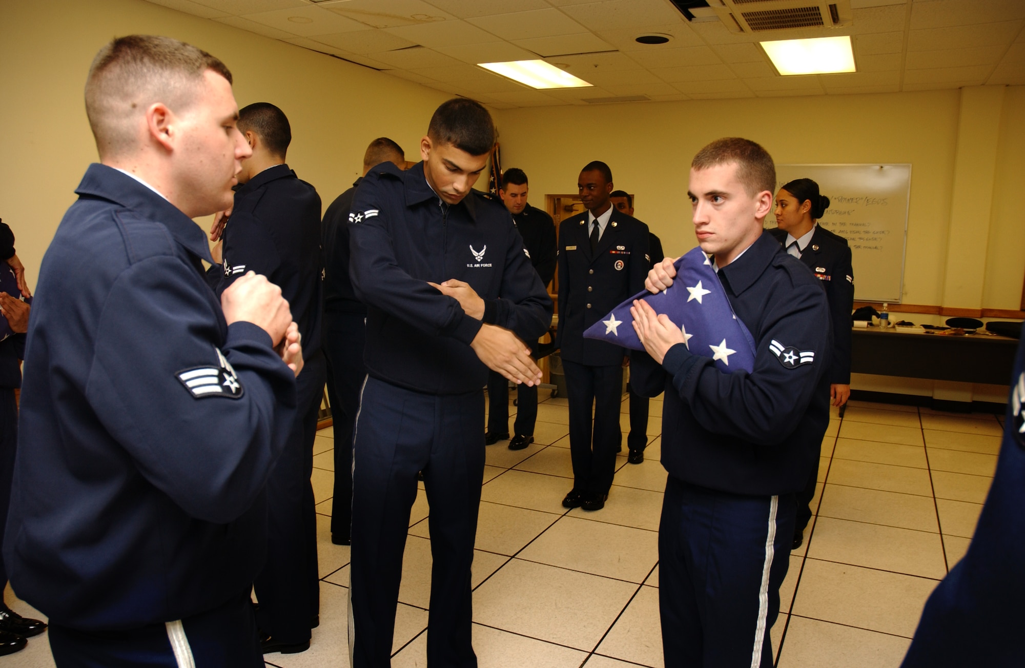 Senior Airman James Sidebottom, 18th Equipment Maintenance Squadron, Airman 1st Class Bryan Ulloa, 18th Services Squadron, and Airman 1st Class Henry Kirscht, 18th Munitions Squadron, practice the full dress sequence for retirement and funeral ceremonies, Feb. 2.
Airmen Sidebottom, Ulloa, and Kirscht are all part of the Kadena Honor Guard.
(U.S. Air Force photo/Senior Airman Jeremy McGuffin) 