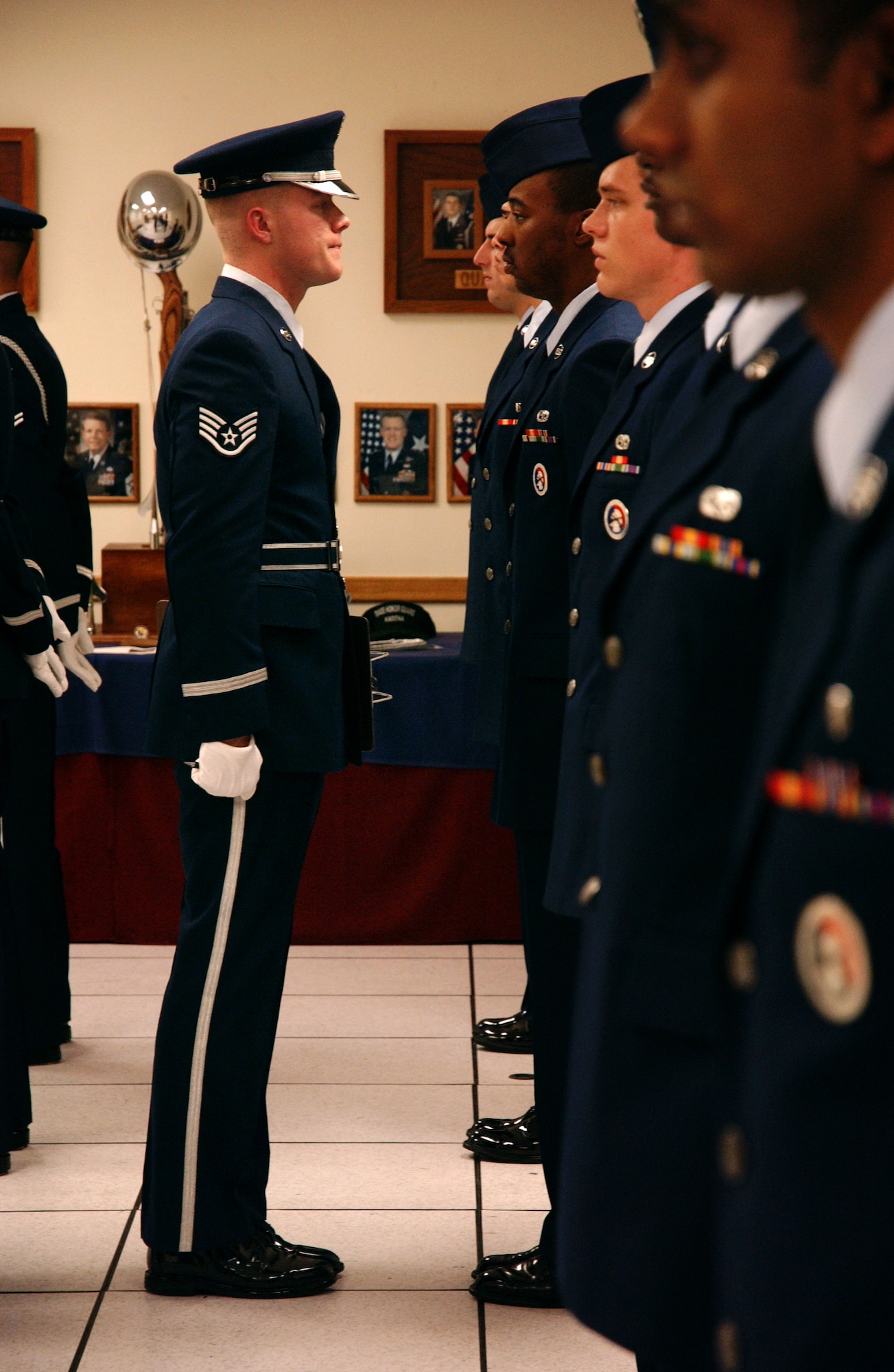 Staff Sgt. Christopher Corbine, 18th Component Maintenance Squadron, conducts open ranks of all the Honor Guard Airmen's ceremonial uniforms and takes note of any discrepancies, Feb. 6. 
(U.S. Air Force photo/Senior Airman Jeremy McGuffin) 