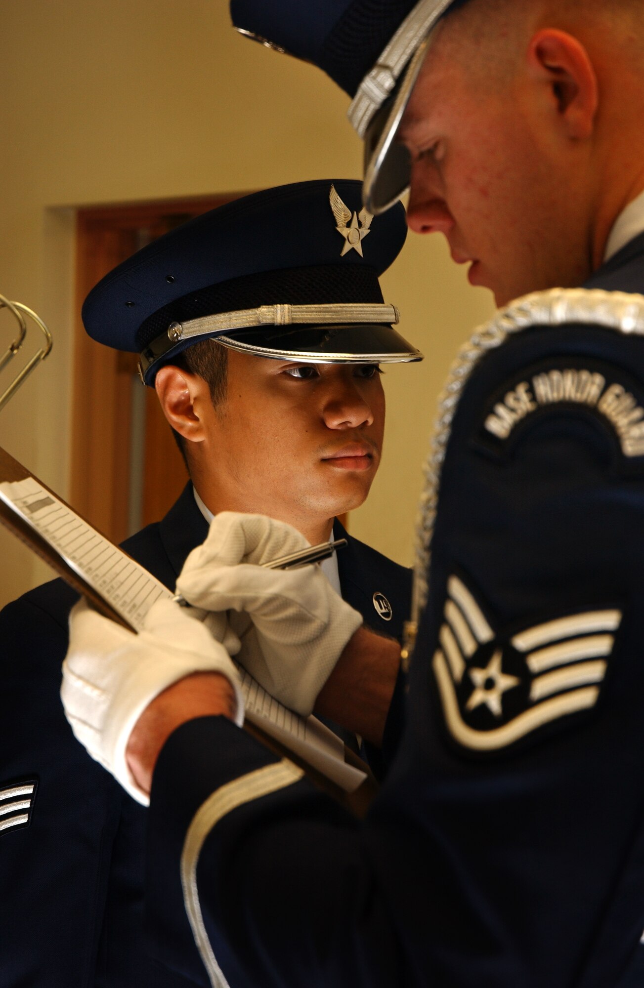 Staff Sgt. Christopher Corbine, 18th Component Maintenance Squadron, thoroughly inspects Senior Airman James Balajadia, 18th Equipment Maintenance Squadron, ceremonial uniform and takes note of any discrepancies during an open ranks inspection Feb. 6. Both Sergeant Corbine and Airman Balajadia are part of the Kadena Honor Guard.
(U.S. Air Force photo/Senior Airman Jeremy McGuffin) 