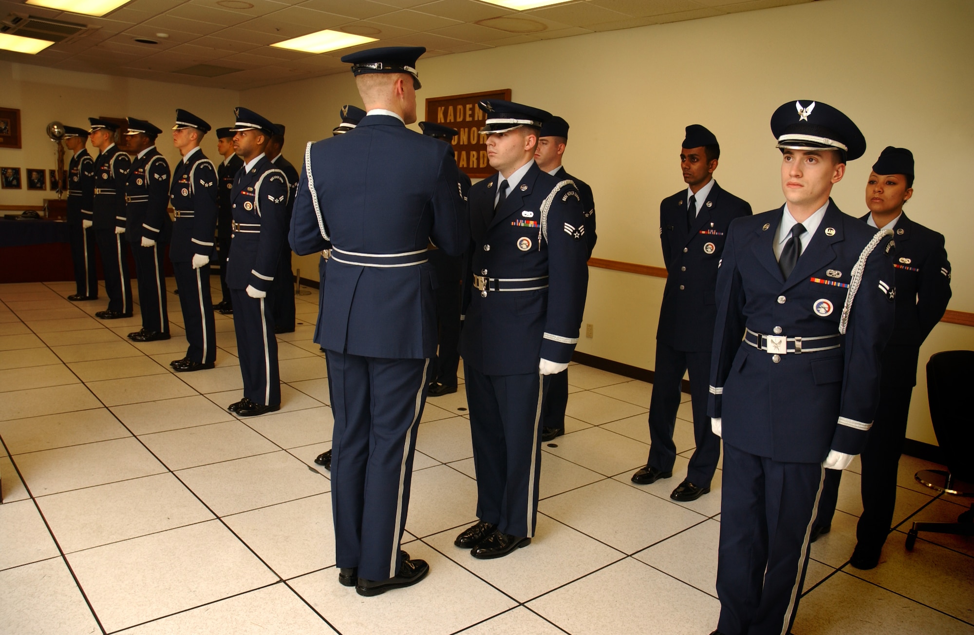 Staff Sgt. Christopher Corbine, 18th Component Maintenance Squadron, conducts open ranks of all the Honor Guard Airmen's ceremonial uniforms and takes note of any discrepancies, Feb. 6. 
(U.S. Air Force photo/Senior Airman Jeremy McGuffin) 