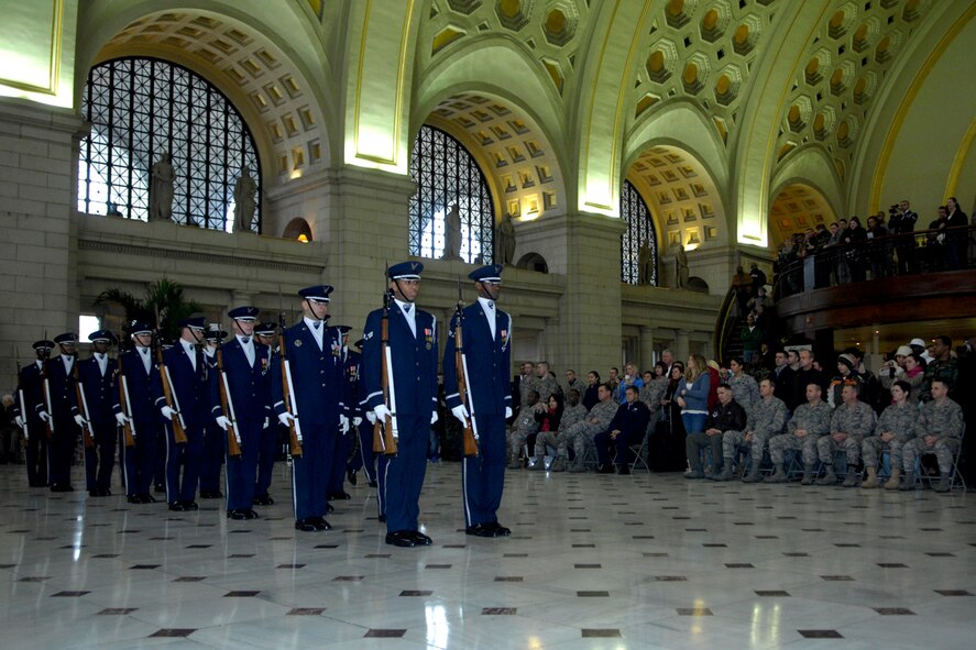 WASHINGTON, DC--The Drill Team marches in to perform their season unveiling in front of their hometown crowd at Union Station in Washington, DC. The unveiling drill is the first drill of the year before the team begins touring and the formal presentation of the 2008 team to AF leadership and the general public. The Drill Team is the traveling component of the Air Force Honor Guard and tours Air Force bases world wide showcasing the precision of today's Air Force to recruit, retain, and inspire Airmen for the Air Force mission. (U.S. Air Force photo by Senior Airman Sean Adams)(Released)