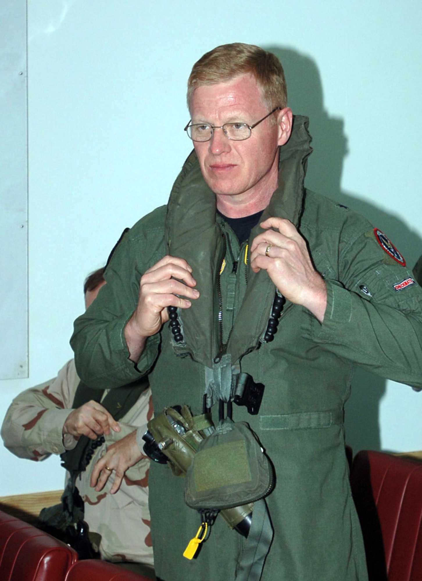 Brig. Gen. Lawrence A. Stutzriem places his personnel protection equipment on before boarding a CH-53 helicopter to fly to Obock, Djibouti form Camp Lemonier, Djibouti, Feb. 24. General Stutzriem was part of the U.S. military flag officers in CAPSTONE who toured the Combined Joint Task Force-Horn of Africa-led construction sites. Forty-five U.S. military senior leaders are touring combatant commands as part of the overseas field study in the CAPSTONE course designed for newly appointed generals or equivalents. General Stutzriem is the Air Force Strategic Studies Group-CHECKMATE chief of staff.  (U.S. Air Force photo/Staff Sgt. Jennifer Redente)