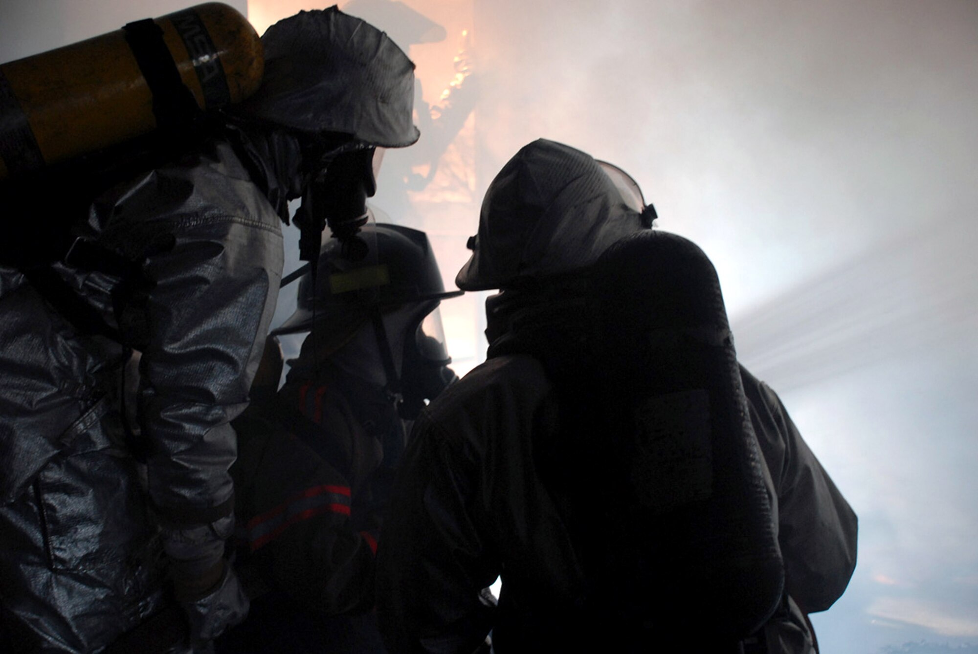 Honduran firefighters extinguish a blaze in the Joint Task Force-Bravo "burn house," a two-level training structure used to provide firefighters with a realistic firefighting experience. The firefighters are participating in a JTF-Bravo-sponsored firefighting subject matter expert exchange. Hundreds of firefighters from fire departments across Honduras have participated over the last two years. (U.S. Air Force photo/Tech. Sgt. William Farrow) 