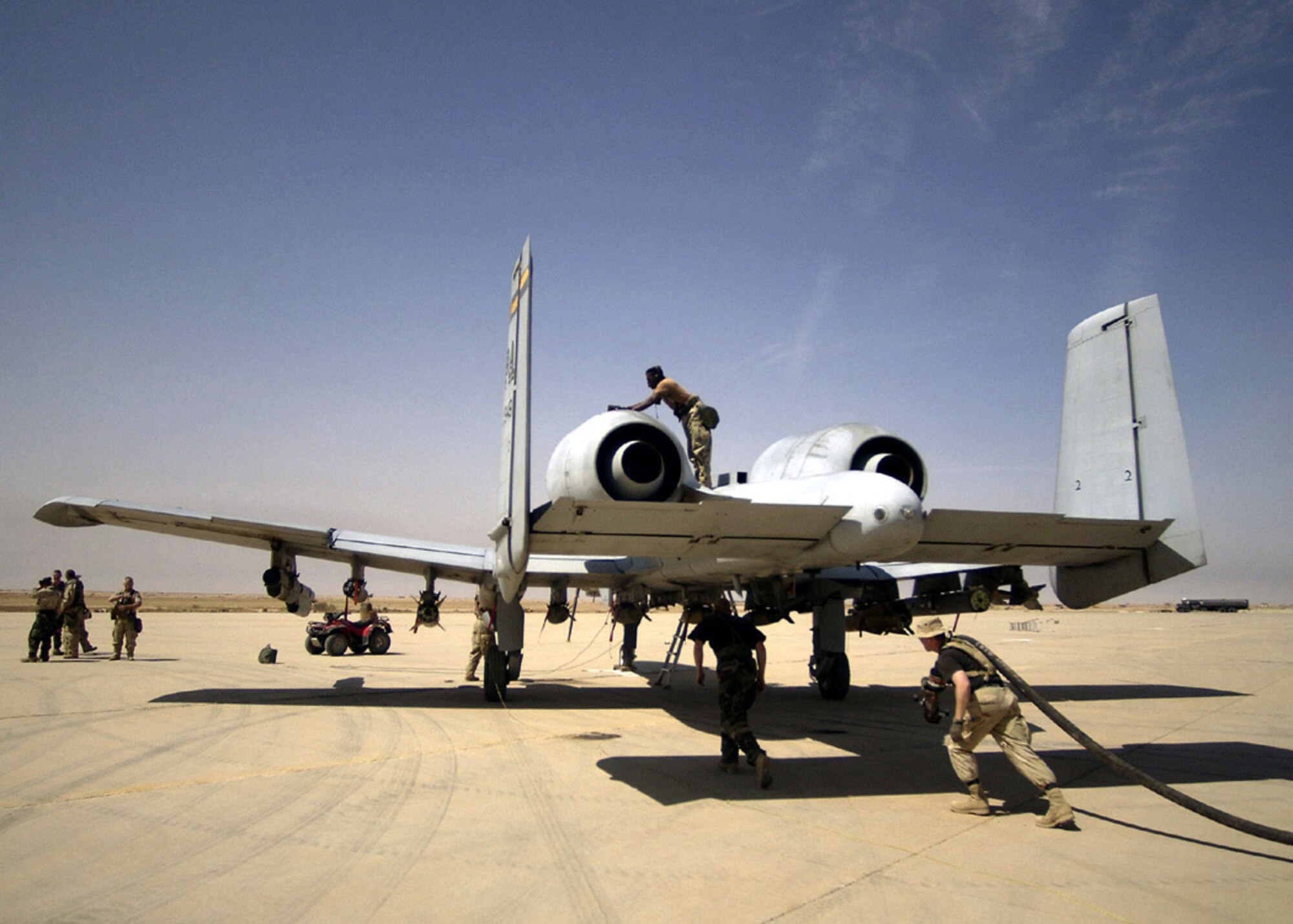 392nd Air Expeditionary Wing aircraft maintenance personnel inspect and refuel an A-10 Thunderbolt II aircraft at a forward-deployed location in Southern Iraq in support of Operation Iraqi Freedom. (U.S. Air Force photo/Staff Sgt. Shane Cuomo)