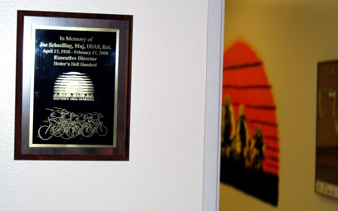 A plaque hangs outside room CC104 in Bldg. 1956 in rememberance of former Hotter 'N Hell Hundred executive director Joe Schaelling. Schaelling died one week before the HHH-themed room was dedicated at the 361st Training Squadron Feb. 22. (U.S. Air Force photo/John Ingle)