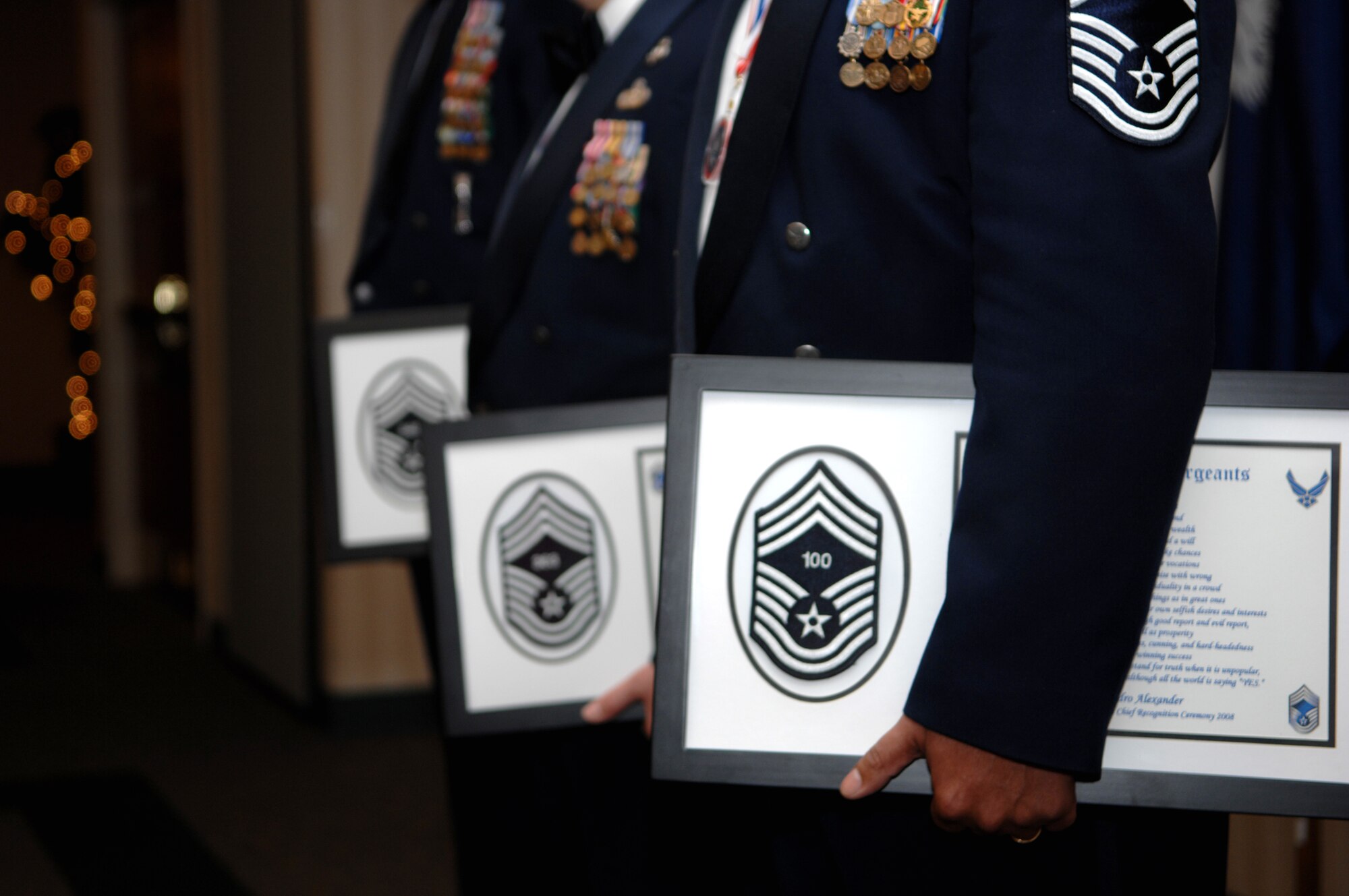 MOODY AIR FORCE BASE, Ga. – Three of Moody's newest chief master sergeants hold their plaques during the conclusion of the Chief Induction Ceremony here Feb 23.  During this ceremony, four Airmen joined the ranks of the U.S. Air Force's highest enlisted grade.(U.S. Air Force photo by Senior Airman Angelita Lawrence)