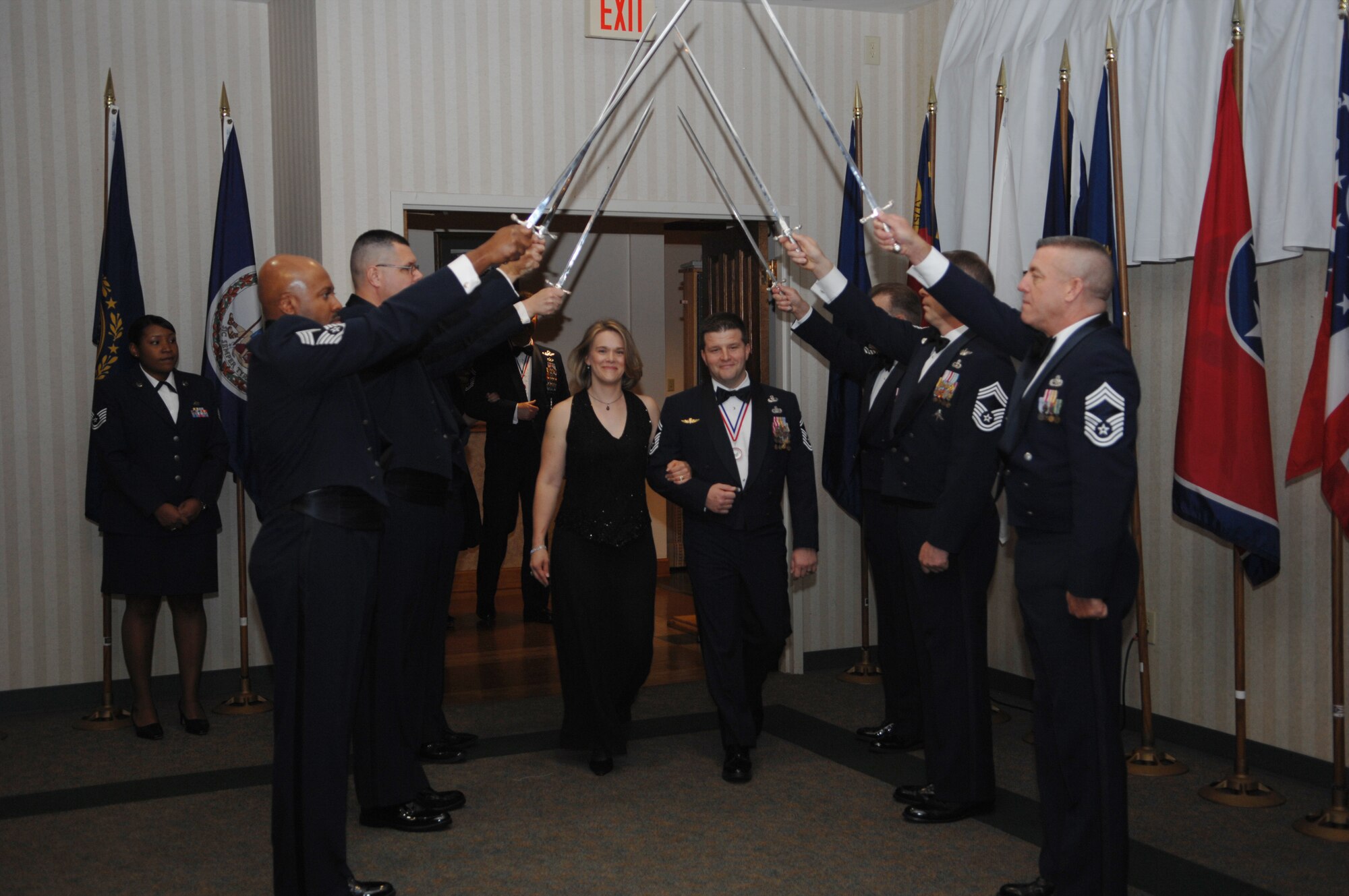 MOODY AIR FORCE BASE, Ga. – Senior Master Sgt. James Johnson, 822nd Security Forces Squadron manager, is escorted by his wife Rachelle Johnson during the Chief’s Induction Ceremony here Feb 23. (U.S. Air Force photo by Senior Airman Angelita Lawrence)