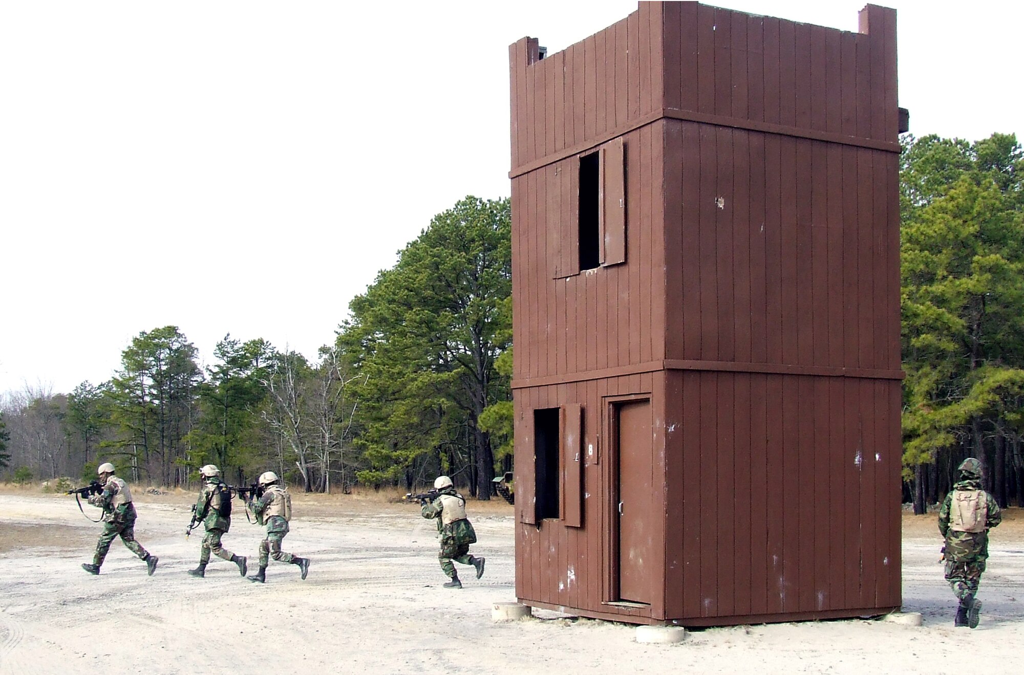 Students in the Air Force Phoenix Warrior Training Course 08-3 practice a military operations in urban terrain scenario scenario during training on a range Feb. 20, 2008, on Fort Dix, N.J.  The course is taught by the U.S. Air Force Expeditionary Center's Expeditionary Operations School and 421st Combat Training Squadron and prepares security forces Airmen for upcoming deployments.  (U.S. Air Force Photo/Tech. Sgt. Scott T. Sturkol)