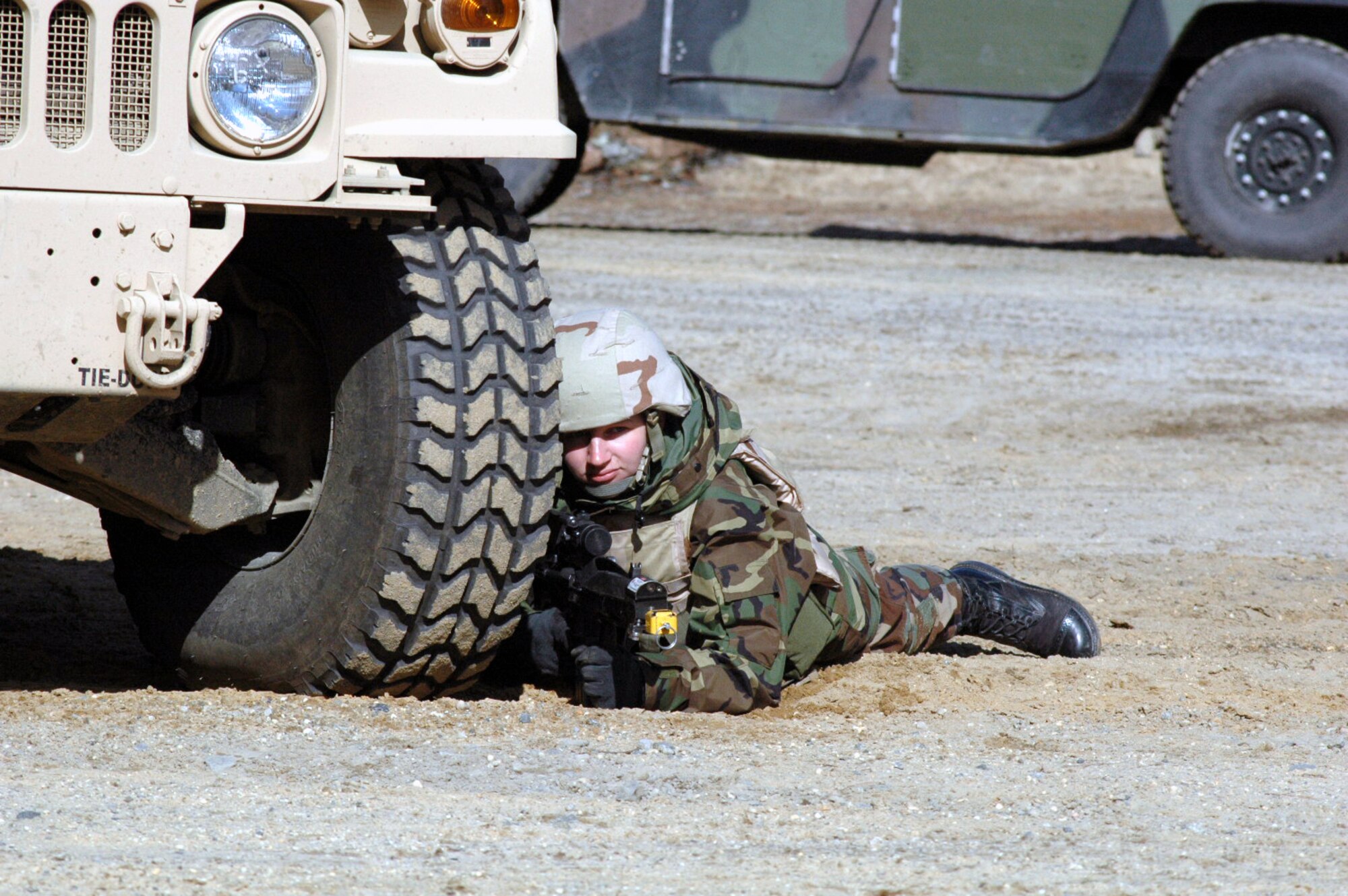 Airman 1st Class Rachel Debolt, 569th United Sates Forces Police Squadron, Vogelweh Air Base, Germany, and a student in the Air Force Phoenix Warrior Training Course 08-3, takes up a defensive position during a scenario for training for the course Feb. 20, 2008, on a range on Fort Dix, N.J.  The course is taught by the U.S. Air Force Expeditionary Center's Expeditionary Operations School and 421st Combat Training Squadron and prepares security forces Airmen for upcoming deployments.  (U.S. Air Force Photo/Tech. Sgt. Scott T. Sturkol)