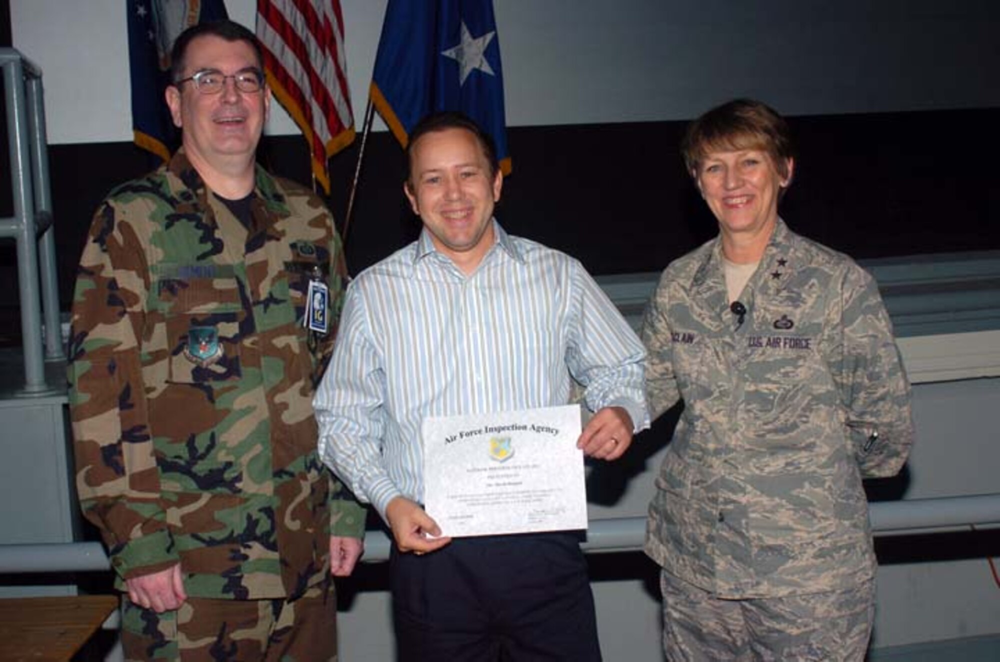 From left, Lt. Col. Robert Bement, UCI Inspection Team Chief; Dave Bennett from the Air Force Personnel Center; and Maj. Gen. K.C. McClain, AFPC commander, pose after Mr. Bennett received a Superior Performer certificate. He heads the government purchase card program at AFPC, which received an outstanding rating. (U.S. Air Force photo/File)
