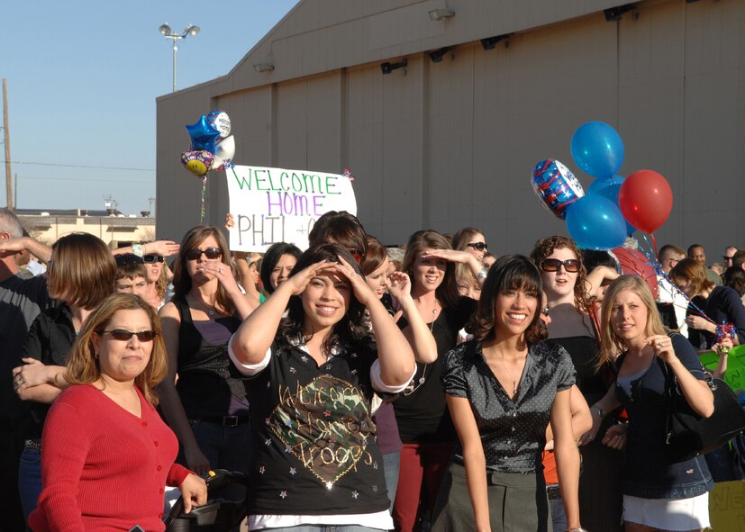 DYESS AIR FORCE BASE, Texas - A group of family and friends eagerly await for their loved ones returning from a four month deployment to Southwest Asia Feb. 19. More than 250 Airmen returned to Dyess.  (U.S. Air Force photo by Airman 1st Class Jennifer Romig)