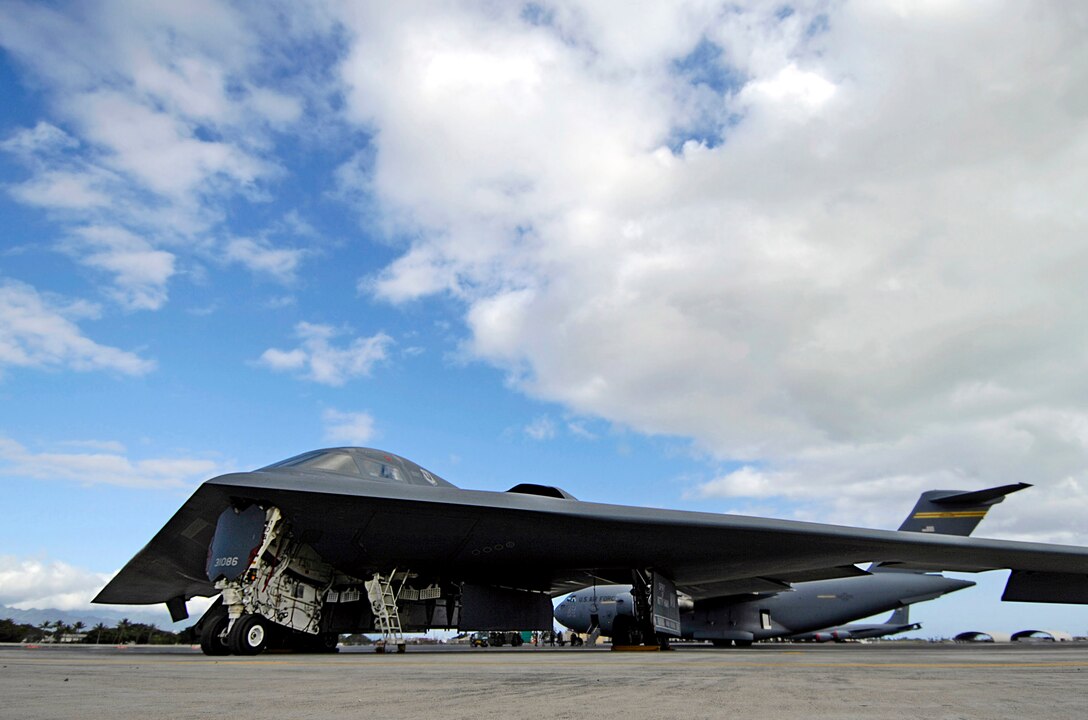 A B-2 Spirit is shown parked Feb. 12 at Hickam Air Force Base, Hawaii. A B-2 crashed Feb. 23 at Andersen Air Force Base, Guam. The two pilots from the 509th Bomb Wing from Whiteman AFB, Mo., ejected and are in good condition. (U.S. Air Force photo/Tech. Sgt. Shane A. Cuomo)